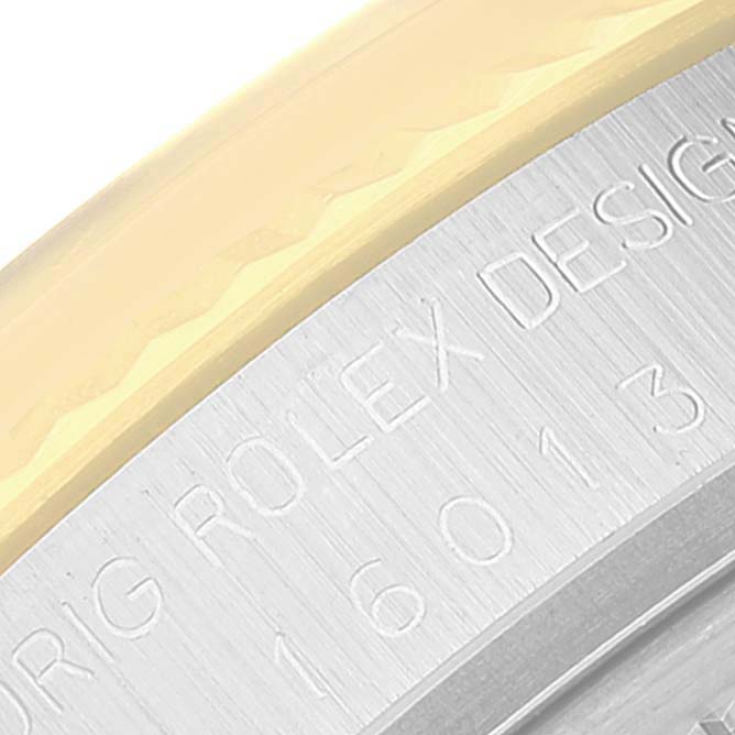 The image shows a close-up of the Rolex Vintage Collection 16013 Men's Steel and Gold (two tone) Champagne Dial 16013 Men's Steel and Gold (two tone) Champagne Dial watch's bezel and engraved case with part of the model number visible.
