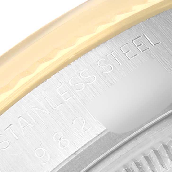 The image shows a close-up of the side and back of a Vintage Collection Rolex watch, highlighting the stainless steel and part of the gold bezel.