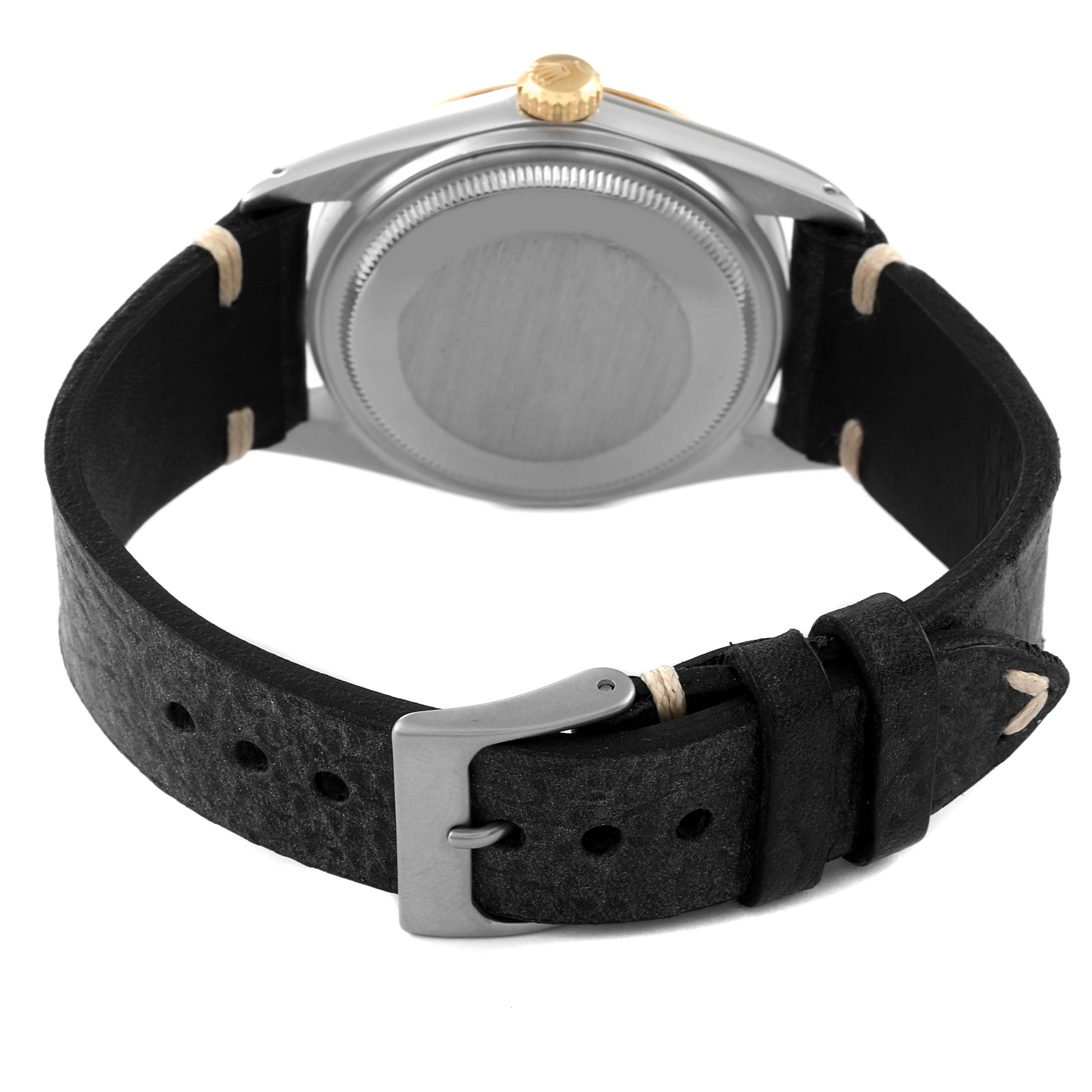 The image shows the back view of a Rolex Vintage Collection 16013 Men's Steel and Gold (two tone) Champagne Dial 16013 Men's Steel and Gold (two tone) Champagne Dial watch, focusing on its case, crown, and leather strap with buckle.