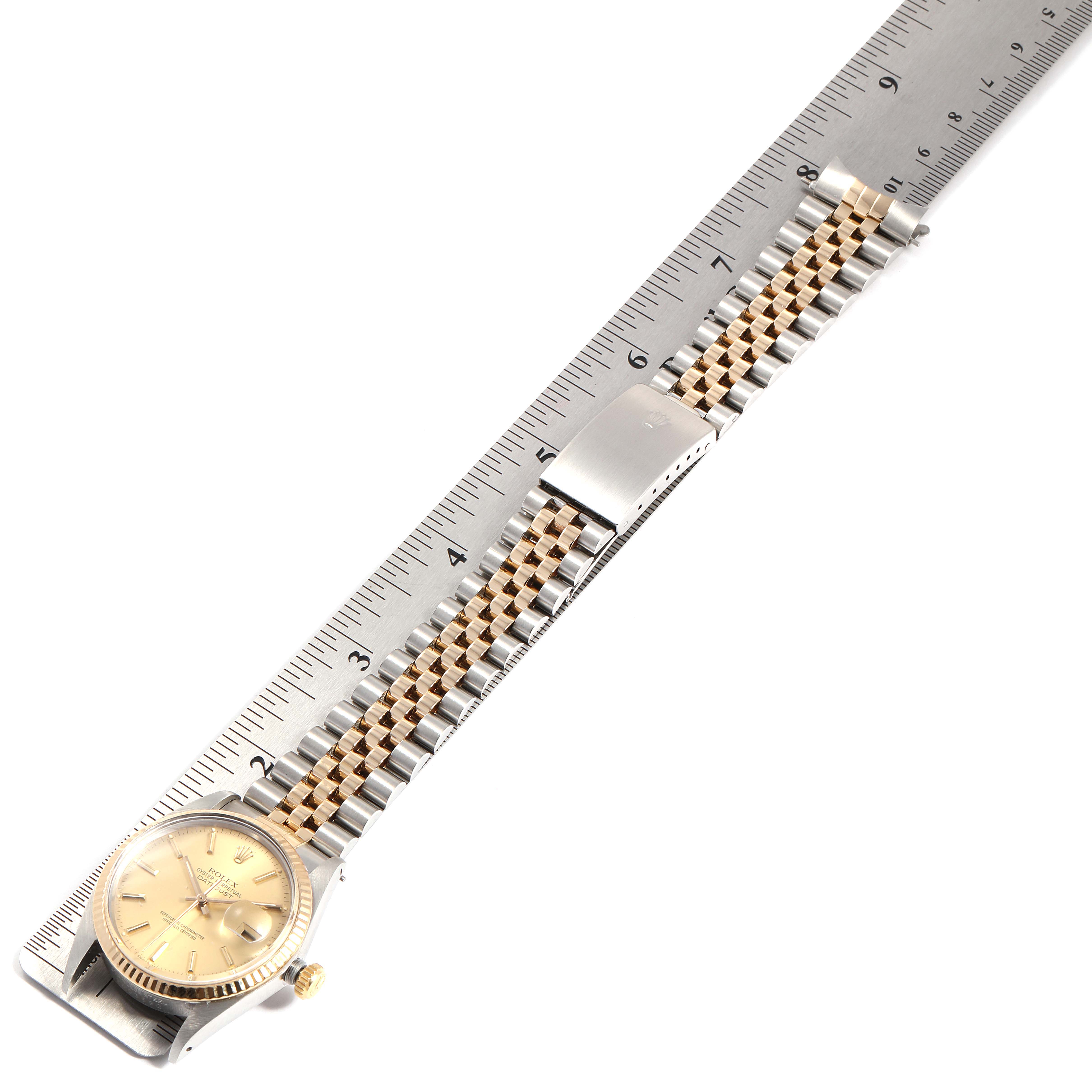 The Rolex Vintage Collection 16013 Men's Steel and Gold (two tone) Champagne Dial 16013 Men's Steel and Gold (two tone) Champagne Dial watch is shown from a top-down view, displaying the full length of its bracelet alongside a ruler for scale.