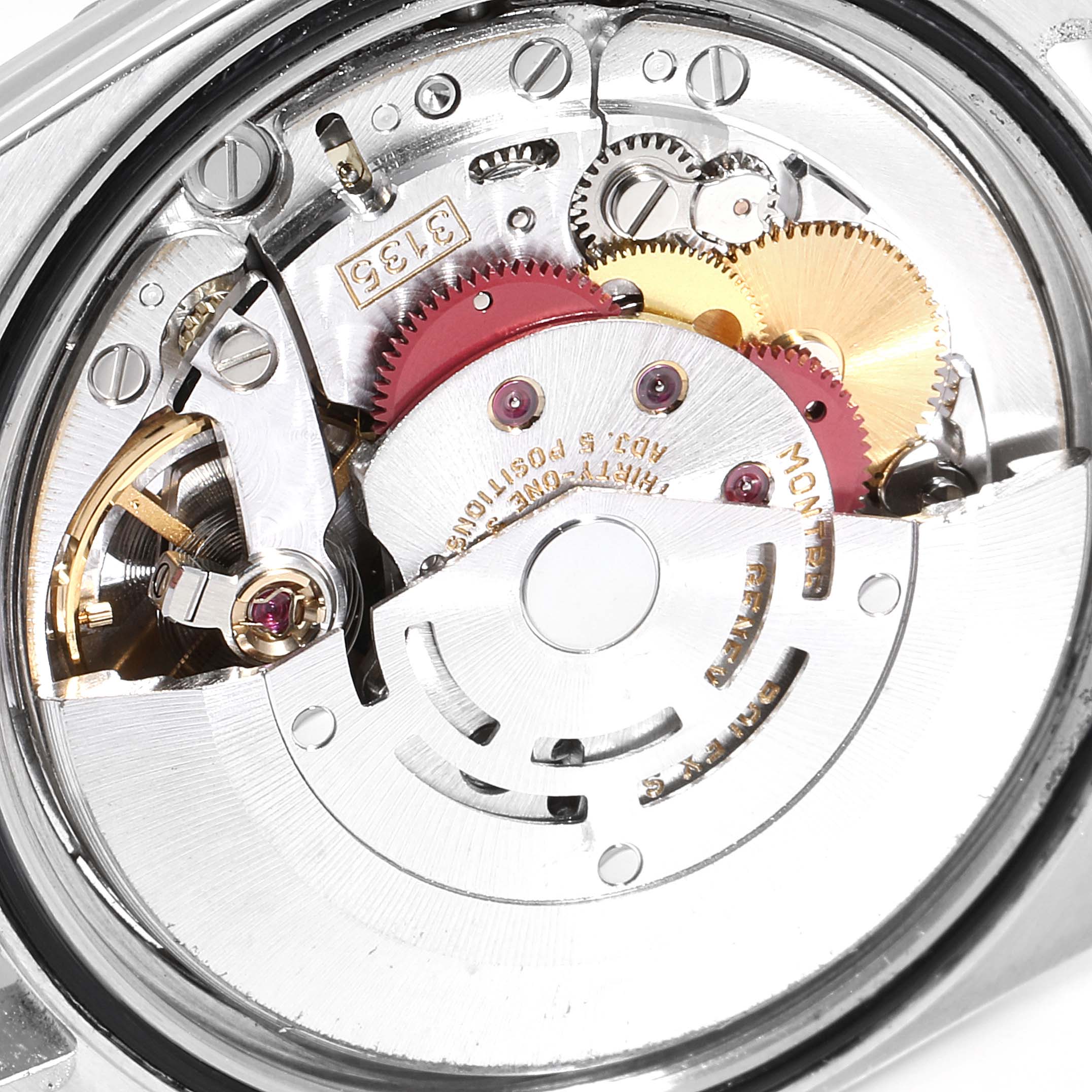 This image shows the internal mechanisms of a Rolex Datejust 16220 Men
s Stainless Steel Black Dial 16220 Men
s Stainless Steel Black Dial watch from the back, highlighting gears and the rotor.