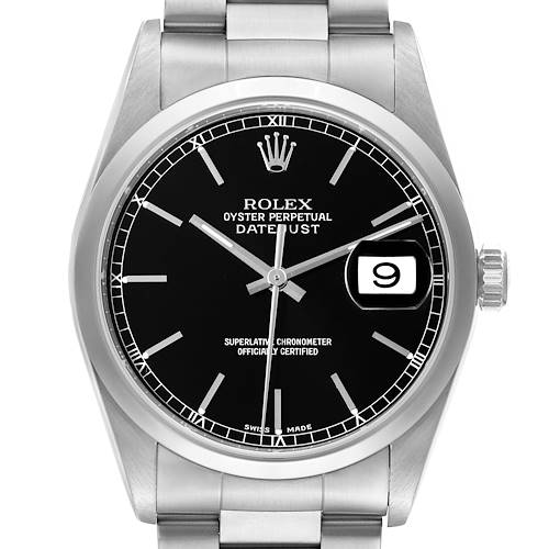 The image shows a frontal view of the Rolex Datejust watch, highlighting the black dial, date window, and stainless steel bracelet.