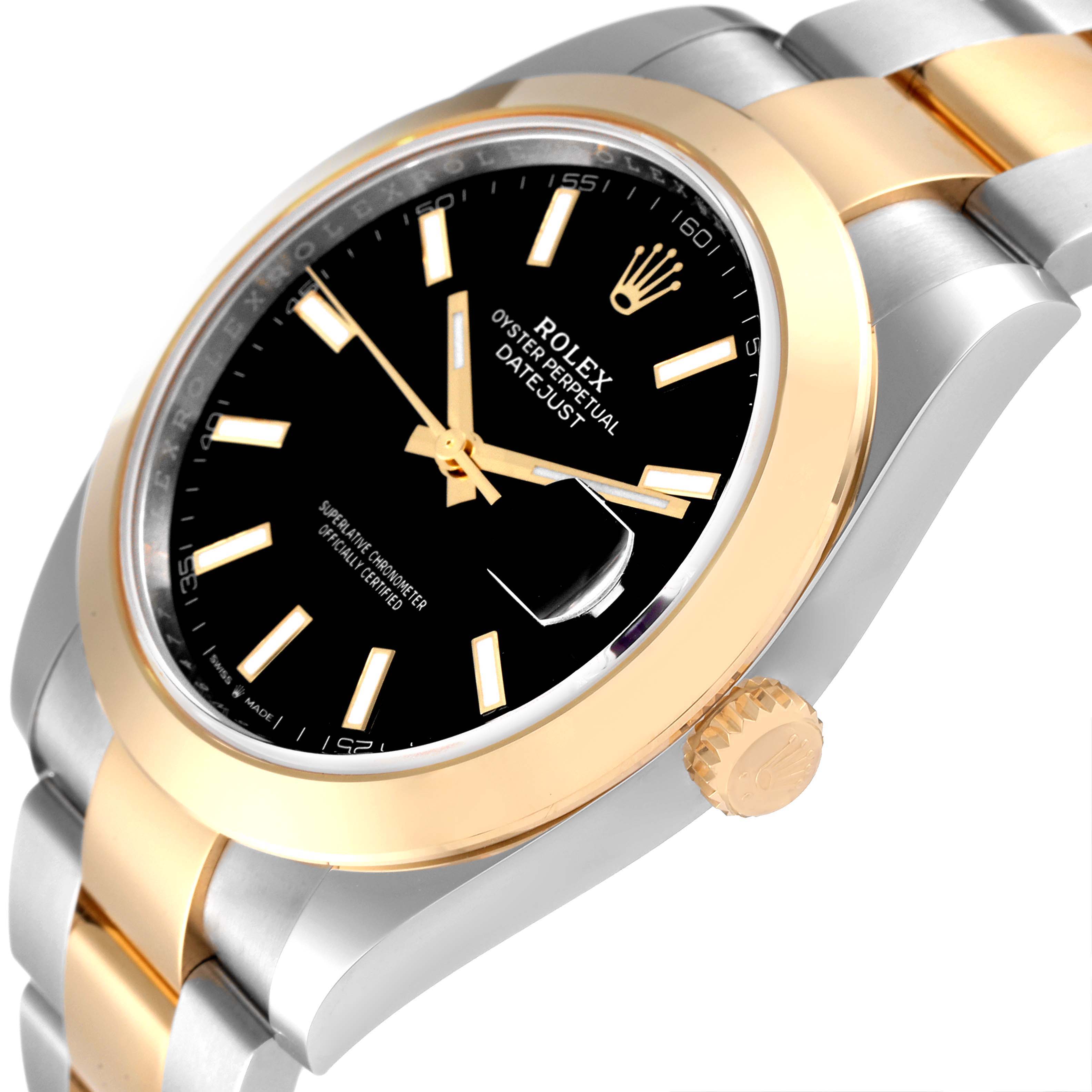 This Rolex Datejust 41 126303 Men's Steel and Gold (two tone) Black Dial 126303 Men's Steel and Gold (two tone) Black Dial watch is viewed at an angle showing the face, bezel, crown, and part of the bracelet.