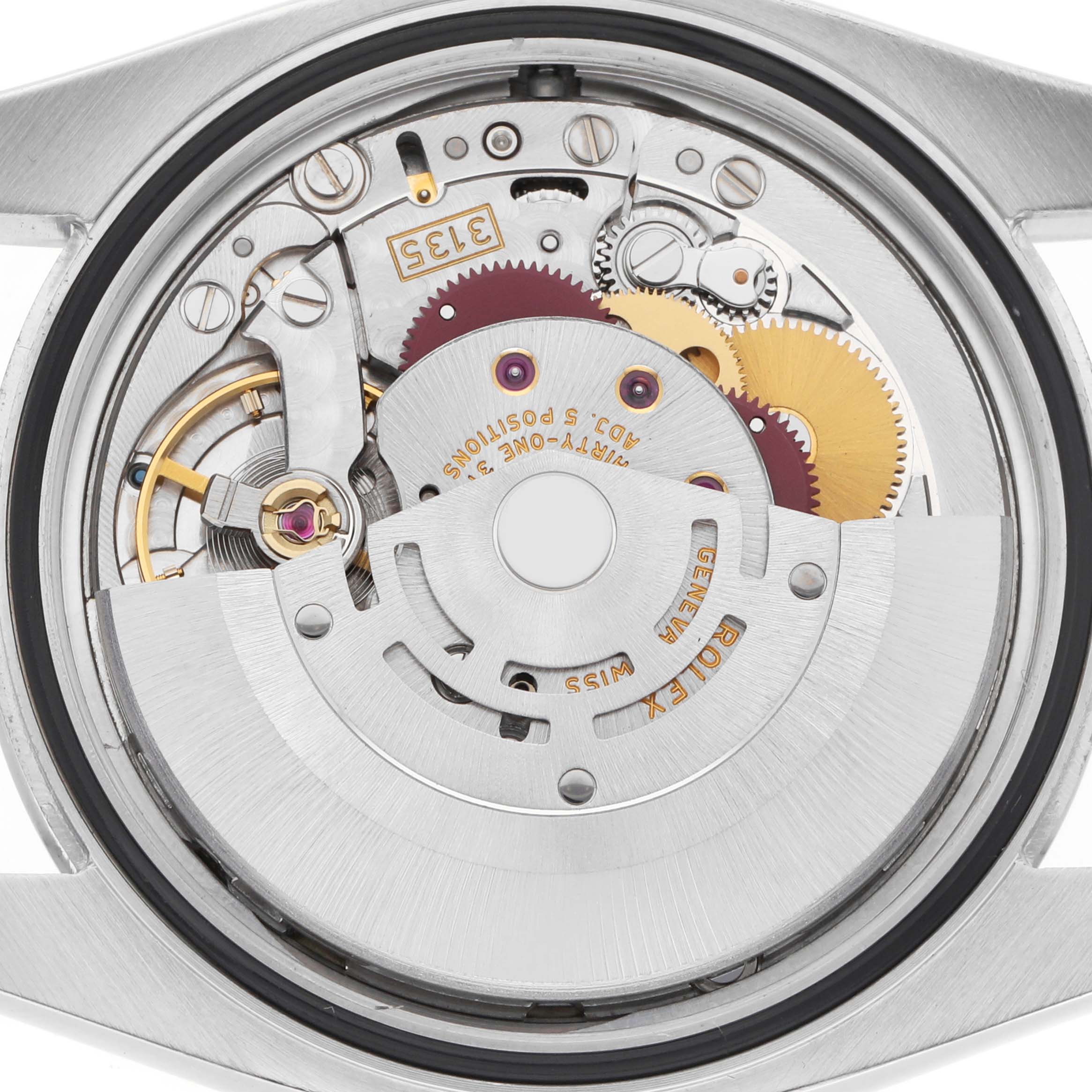 The image shows the open case back of a Rolex Datejust 116200 Men
s Stainless Steel Blue Dial, revealing its intricate movement and internal components.