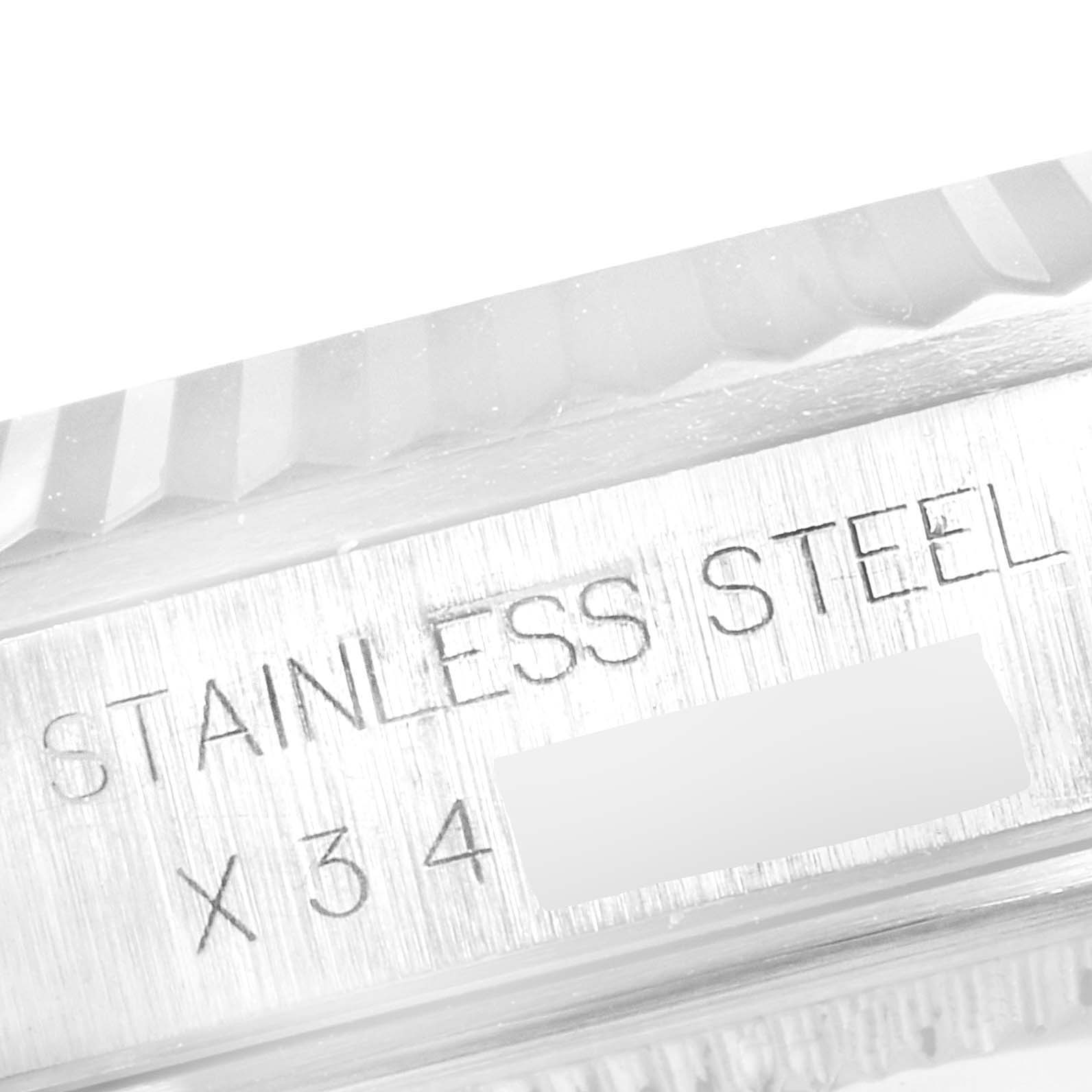 The image shows a close-up of the stainless steel bezel and caseback area of a Rolex Datejust 16234 Men's Stainless Steel Silver Dial 16234 Men's Stainless Steel Silver Dial watch.