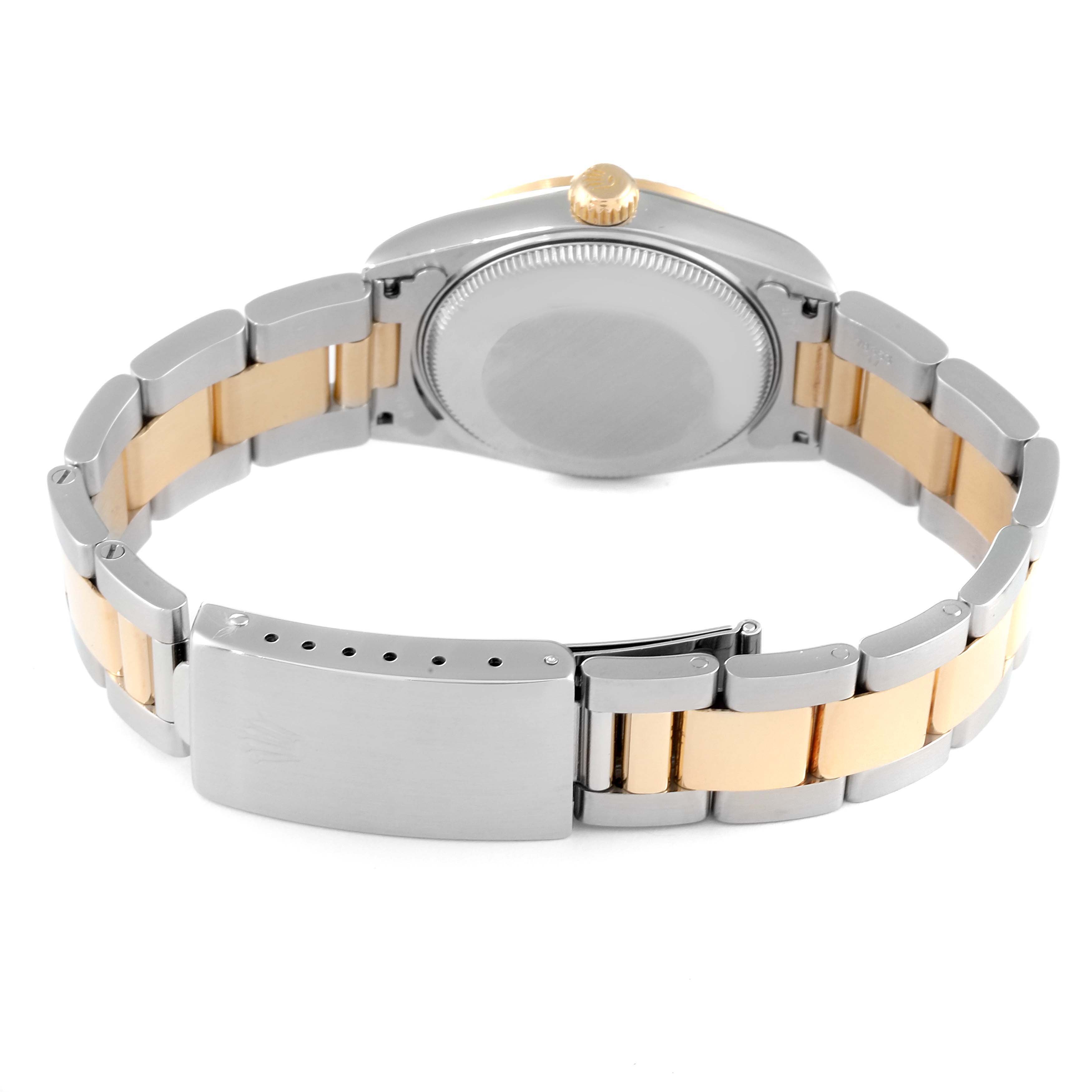 The image shows the back view of a Mid-Size Rolex watch, highlighting the clasp, bracelet, and case back.