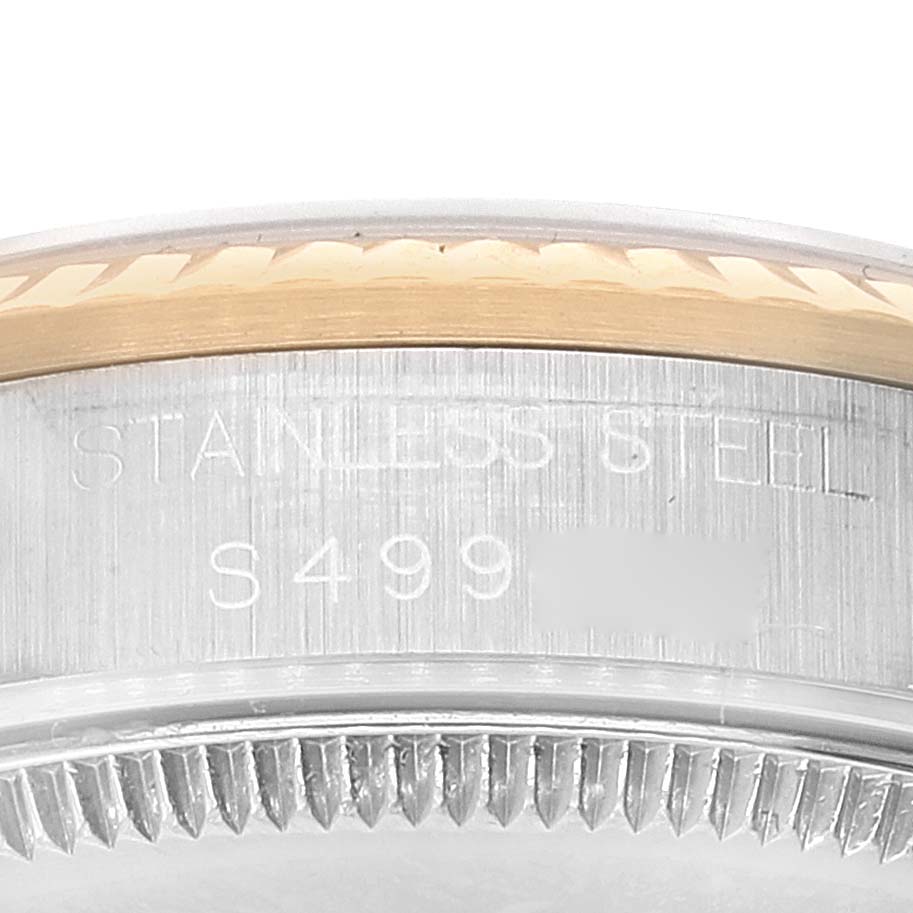 The image shows a close-up angle of the case side and bezel of a Rolex Mid-Size 68273 Women
s Steel and Gold (two tone) Champagne Dial 68273 Women
s Steel and Gold (two tone) Champagne Dial stainless steel watch.