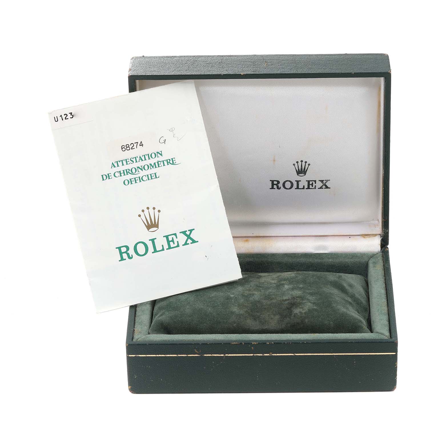 The image shows an open Rolex box with a Mid-Size model booklet titled "Attestation de Chronomètre Officiel."