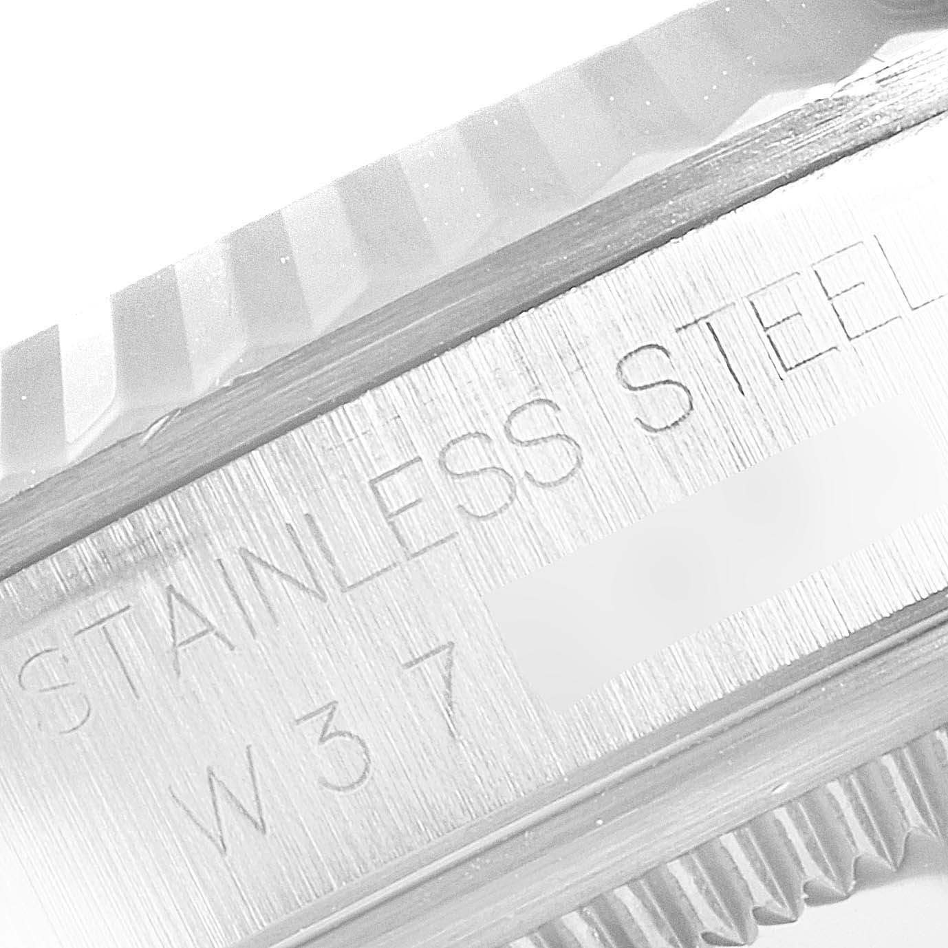 This image shows a close-up view of the side of a Rolex Datejust 16234 Men's Stainless Steel Silver Dial 16234 Men's Stainless Steel Silver Dial watch, featuring the engraved "STAINLESS STEEL" text.