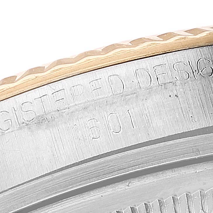 This close-up angle shows the engraved bezel and model number details of the Rolex Vintage Collection 1601 Men
s Steel and Gold (two tone) Silver Dial 1601 Men
s Steel and Gold (two tone) Silver Dial watch.
