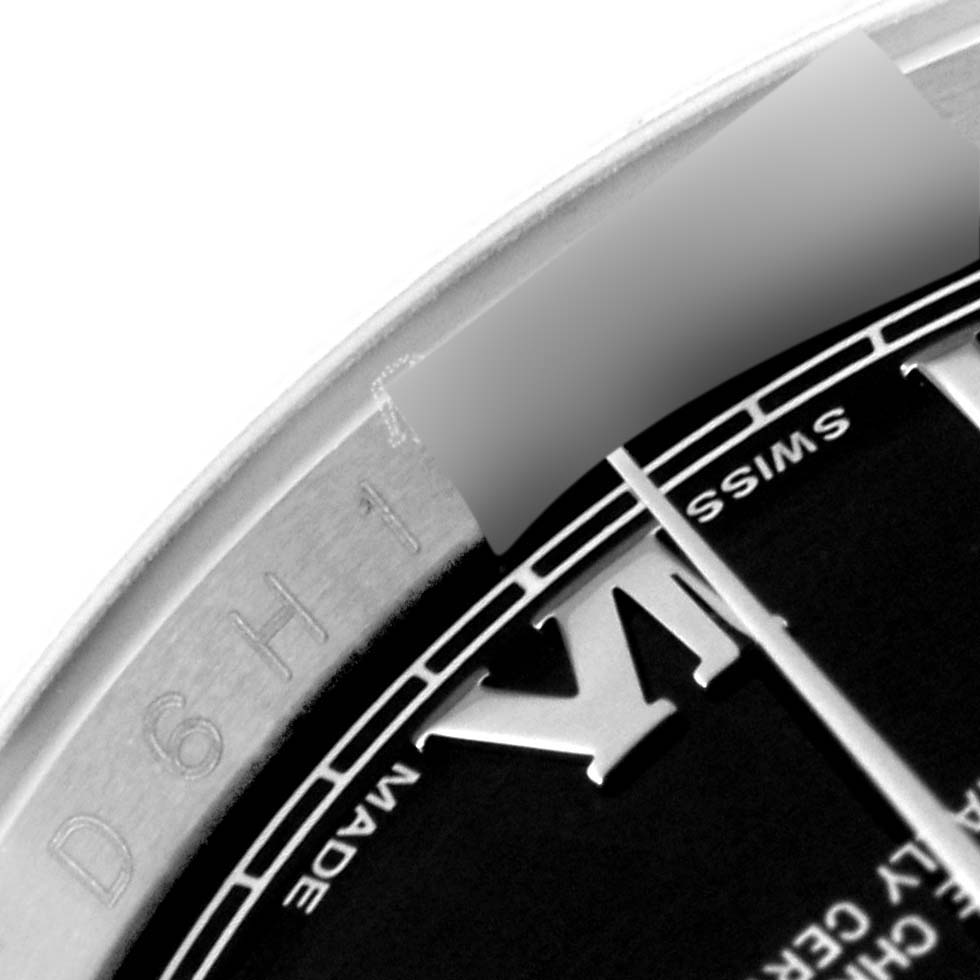 This image shows a close-up of the dial and edge of the Rolex Datejust 116234 Men
s Stainless Steel Black Dial 116234 Men
s Stainless Steel Black Dial watch, highlighting the Roman numeral, "SWISS MADE" text, and serial number.