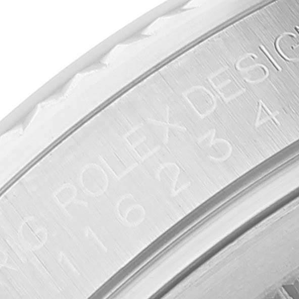 The image shows a close-up of the side engraving on the bezel of a Rolex Datejust 116234 Men
s Stainless Steel Black Dial 116234 Men
s Stainless Steel Black Dial watch.