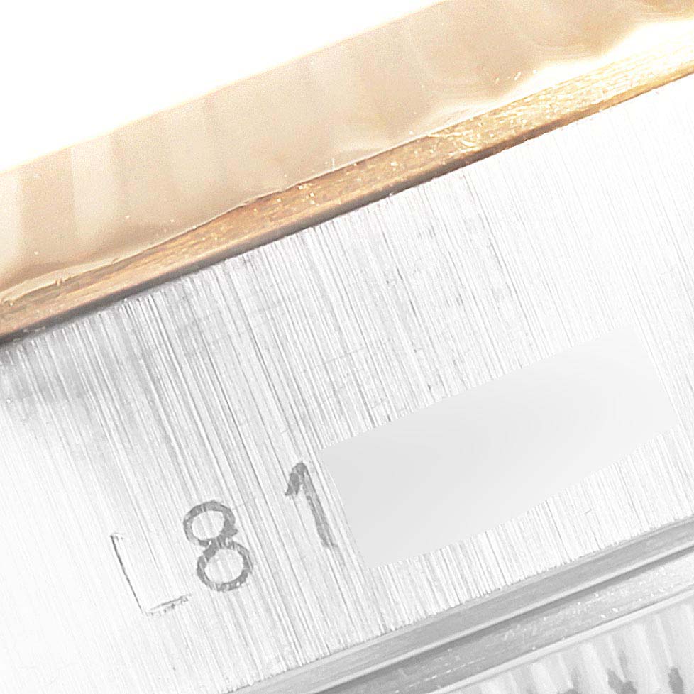 The image shows a close-up of the serial number section on the case side of a Rolex Datejust 69173 Women's Steel and Gold (two tone) Champagne Dial 69173 Women's Steel and Gold (two tone) Champagne Dial watch.