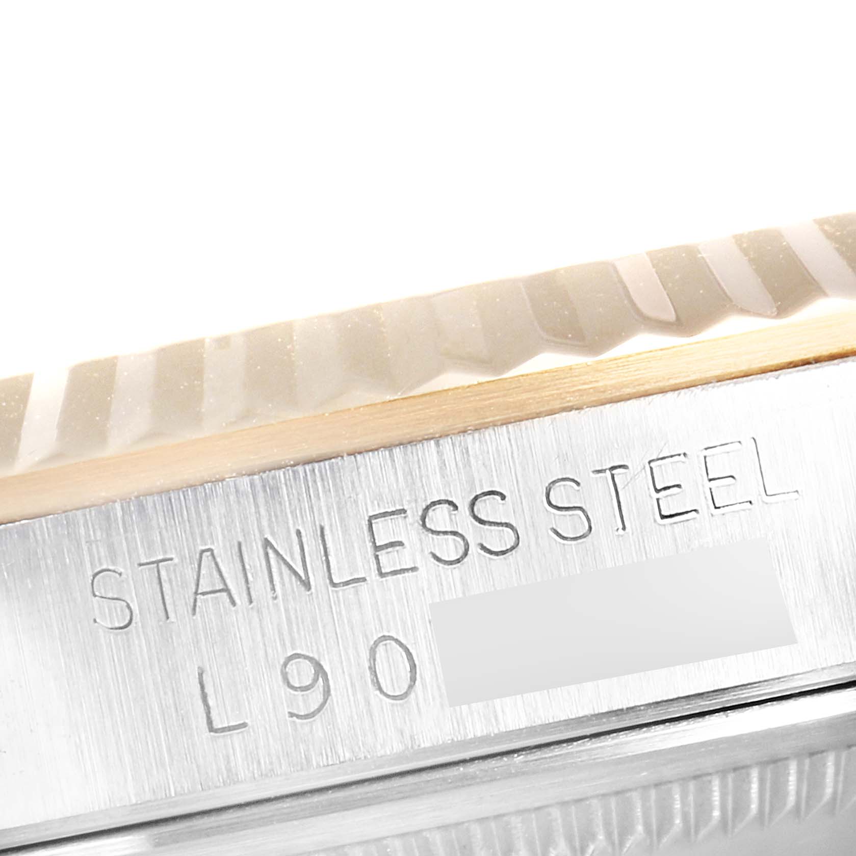 The image shows a close-up of the stainless steel case and fluted bezel of a Rolex Datejust 16233 Men
s Steel and Gold (two tone) Champagne Dial 16233 Men
s Steel and Gold (two tone) Champagne Dial watch.