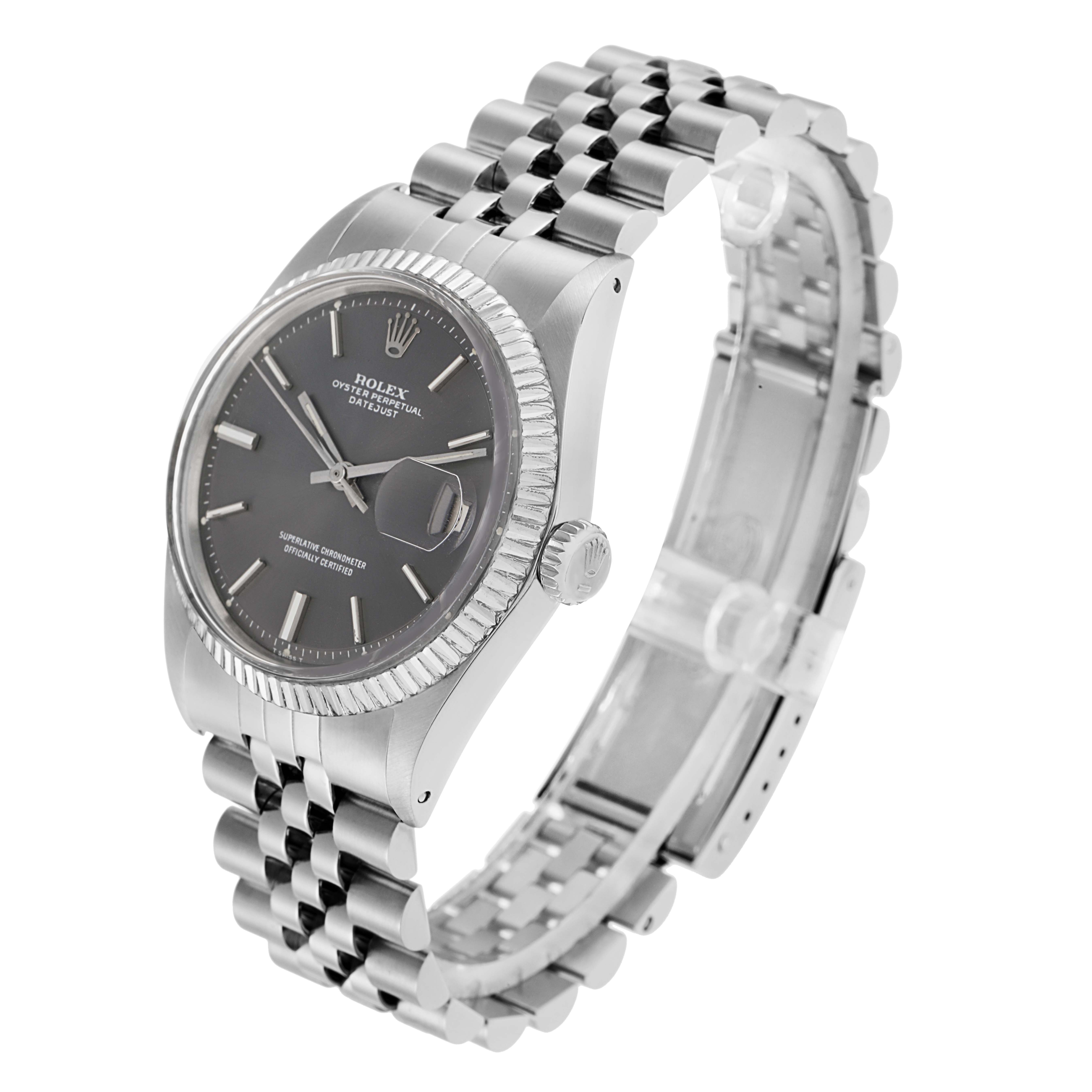 The Rolex Datejust 1601 Men
s Stainless Steel Grey Dial watch is shown at a three-quarter angle, highlighting the face, bezel, crown, and Jubilee bracelet.