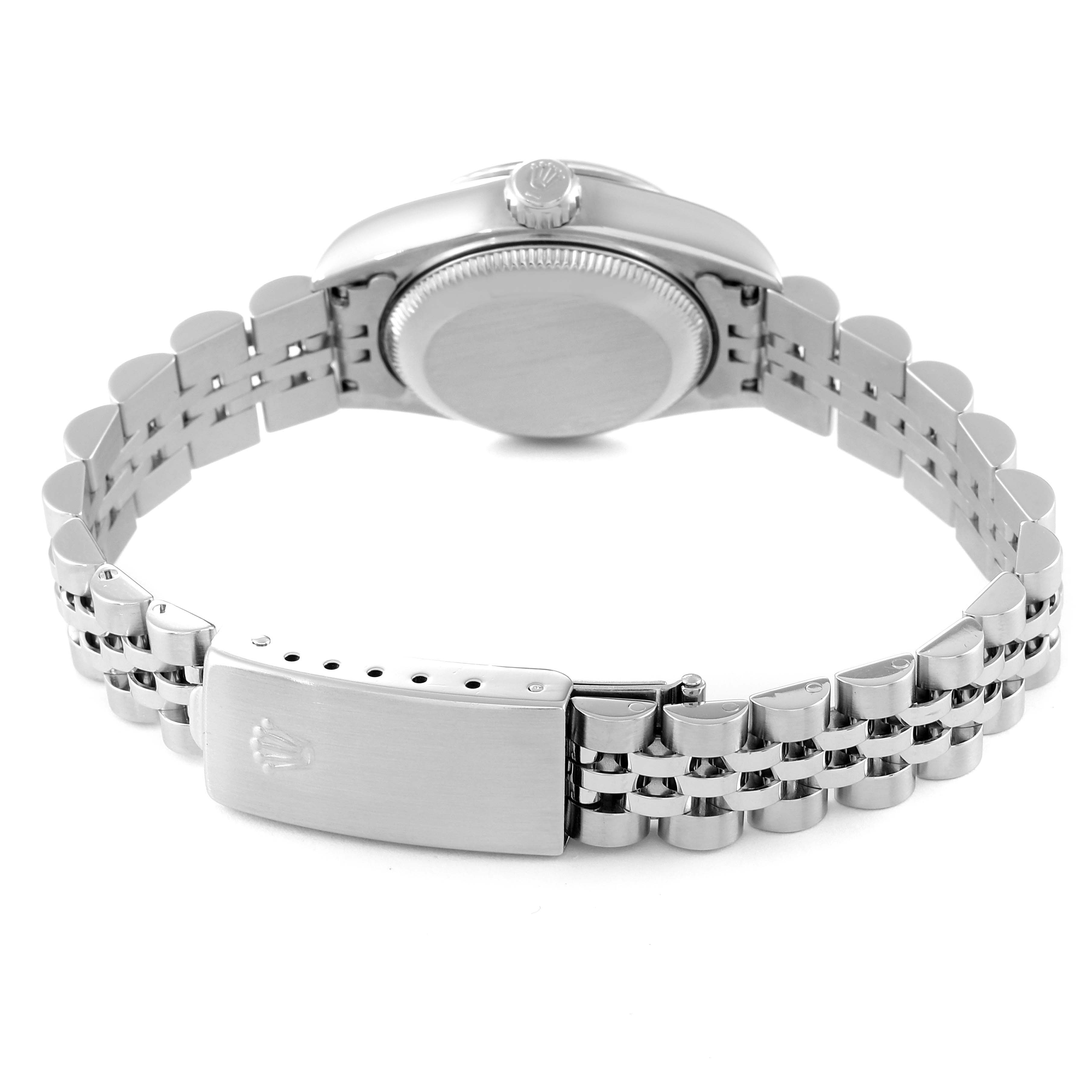 This image of the Rolex Datejust 79174 Women
s Stainless Steel Pink Dial 79174 Women
s Stainless Steel Pink Dial watch shows the back and bracelet in a semi-open position.