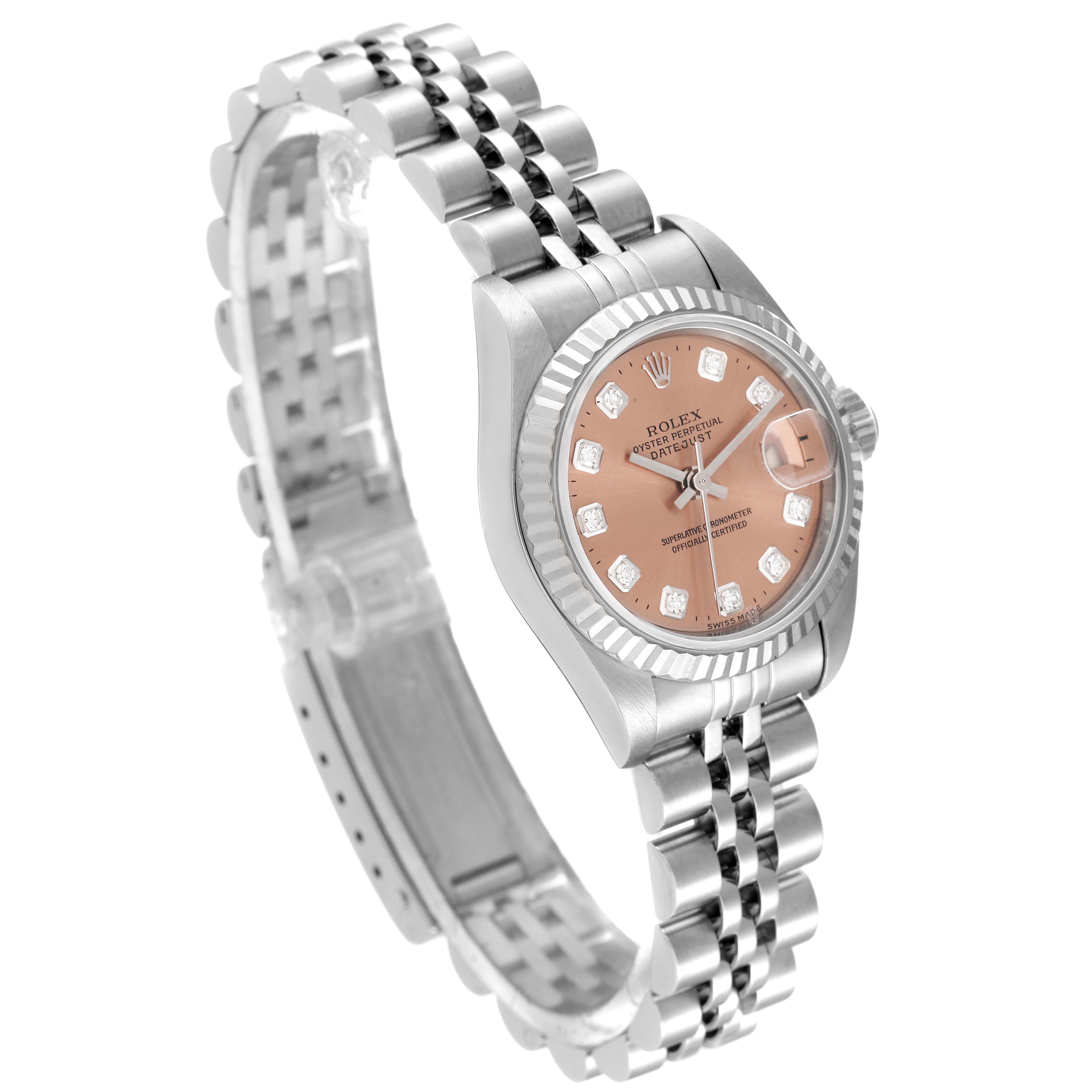 The Rolex Datejust 79174 Women
s Stainless Steel Pink Dial 79174 Women
s Stainless Steel Pink Dial watch is shown at a slight angle highlighting its pink dial, fluted bezel, and jubilee bracelet.