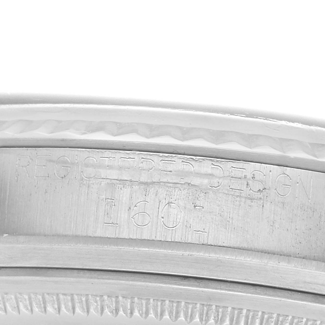 The image shows a close-up angle of the model number engraving on the Rolex Vintage Collection 1601 Men
s Stainless Steel Silver Dial watch case.