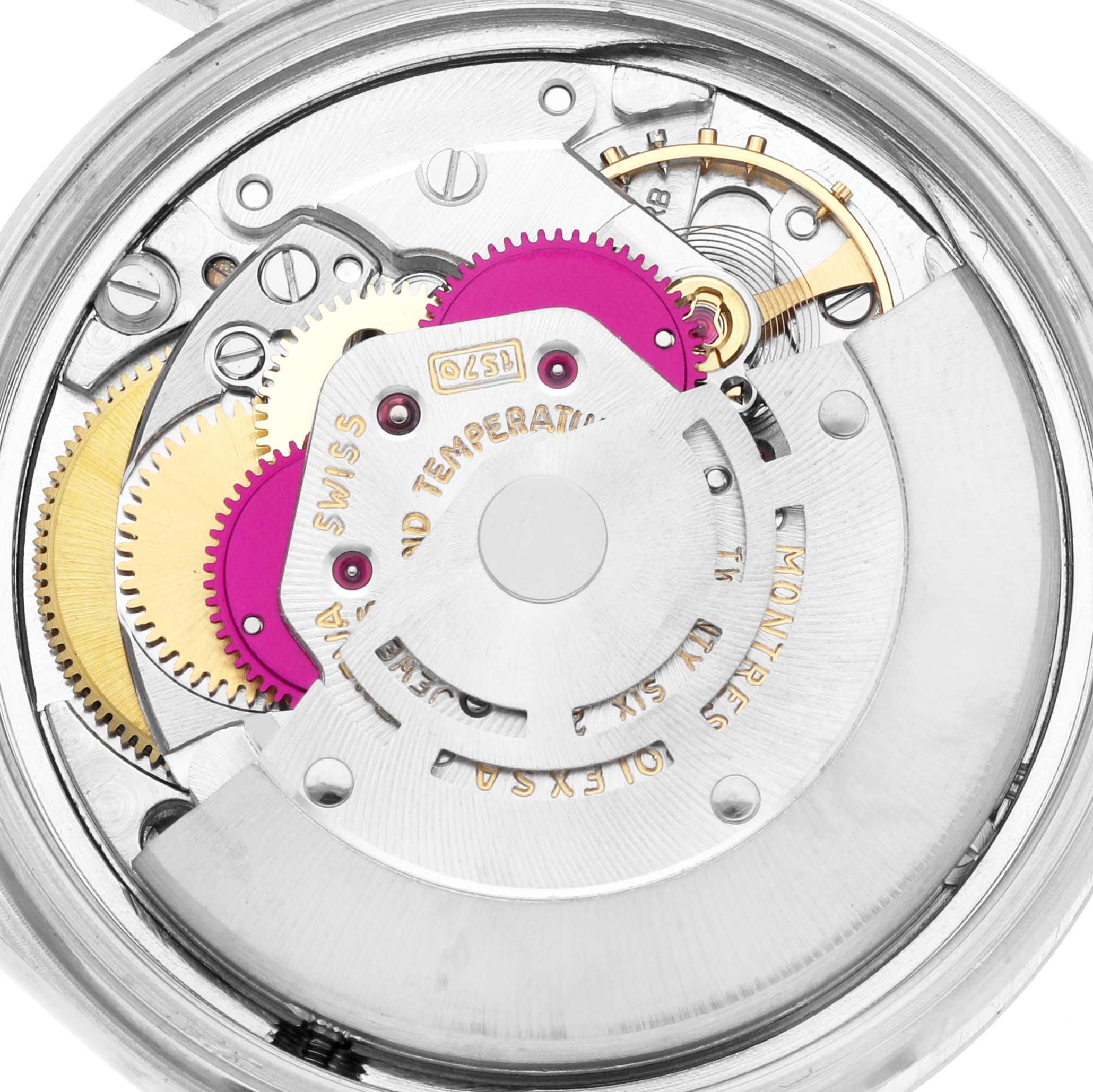 The image shows an up-close view of the Rolex Datejust 1601 Men
s Stainless Steel Silver Dial movement, highlighting gears and internal mechanics.