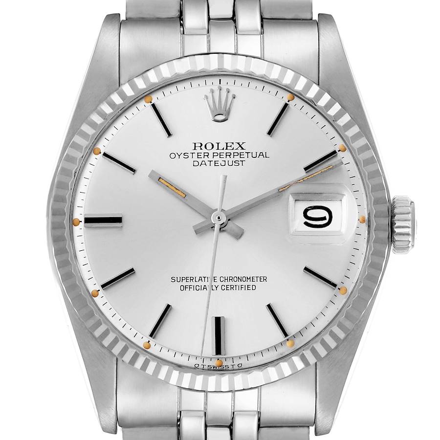 The image shows a frontal view of a Rolex Datejust model 1601 men's watch, highlighting the dial, fluted bezel, and part of the bracelet.
