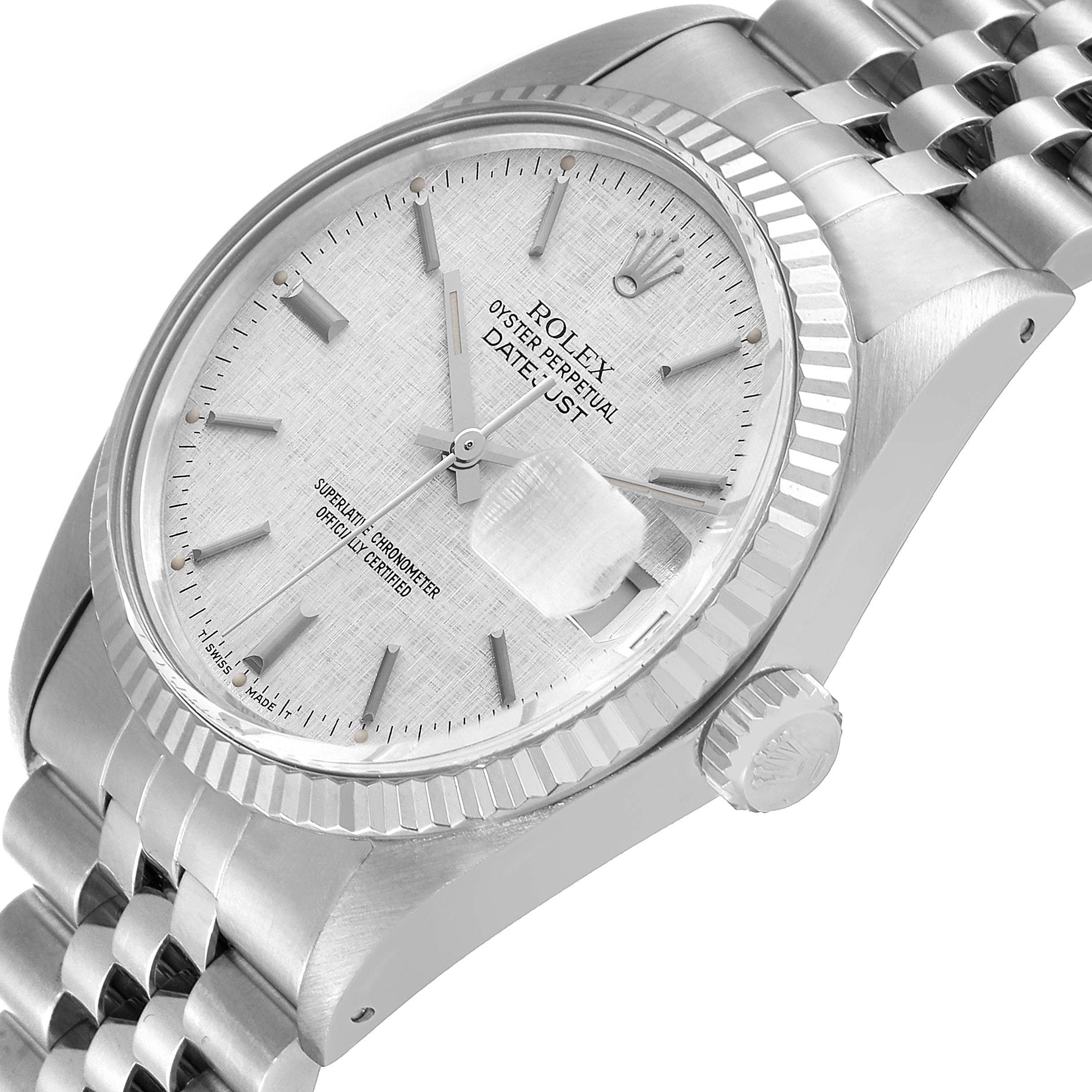 The image shows a Rolex Datejust 16014 Men
s Stainless Steel Silver Dial 16014 Men
s Stainless Steel Silver Dial watch from a tilted angle, displaying its dial, bezel, crown, and bracelet.