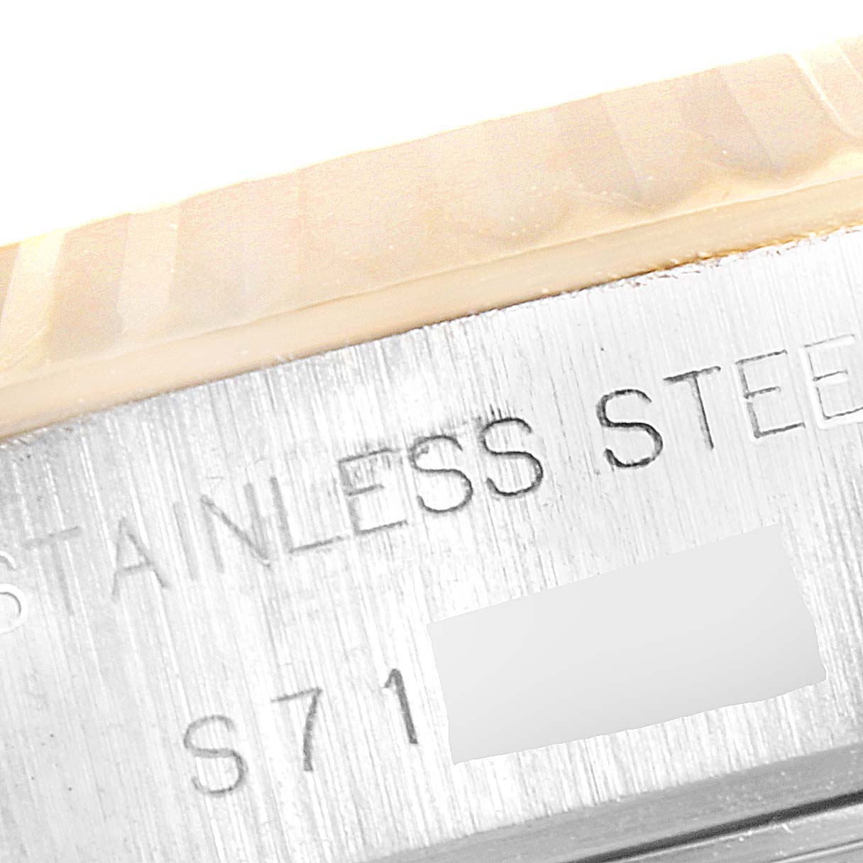 The image shows a close-up of the side case and engraving details on a Rolex Datejust 69173 Women's Steel and Gold (two tone) Beige Dial 69173 Women's Steel and Gold (two tone) Beige Dial watch.