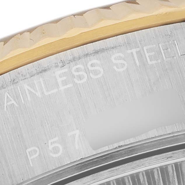This close-up image shows the stainless steel casing and the fluted bezel of a Rolex Datejust 79173 Women's Steel and Gold (two tone) Black Dial 79173 Women's Steel and Gold (two tone) Black Dial watch.