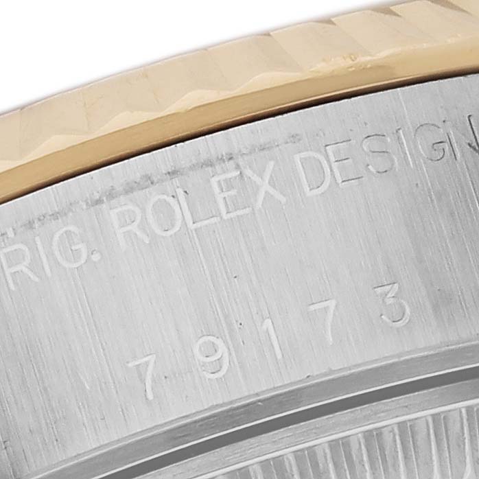 Close-up angle showing the engraved model number and design markings on the case of a Rolex Datejust 79173 Women's Steel and Gold (two tone) Black Dial 79173 Women's Steel and Gold (two tone) Black Dial watch.