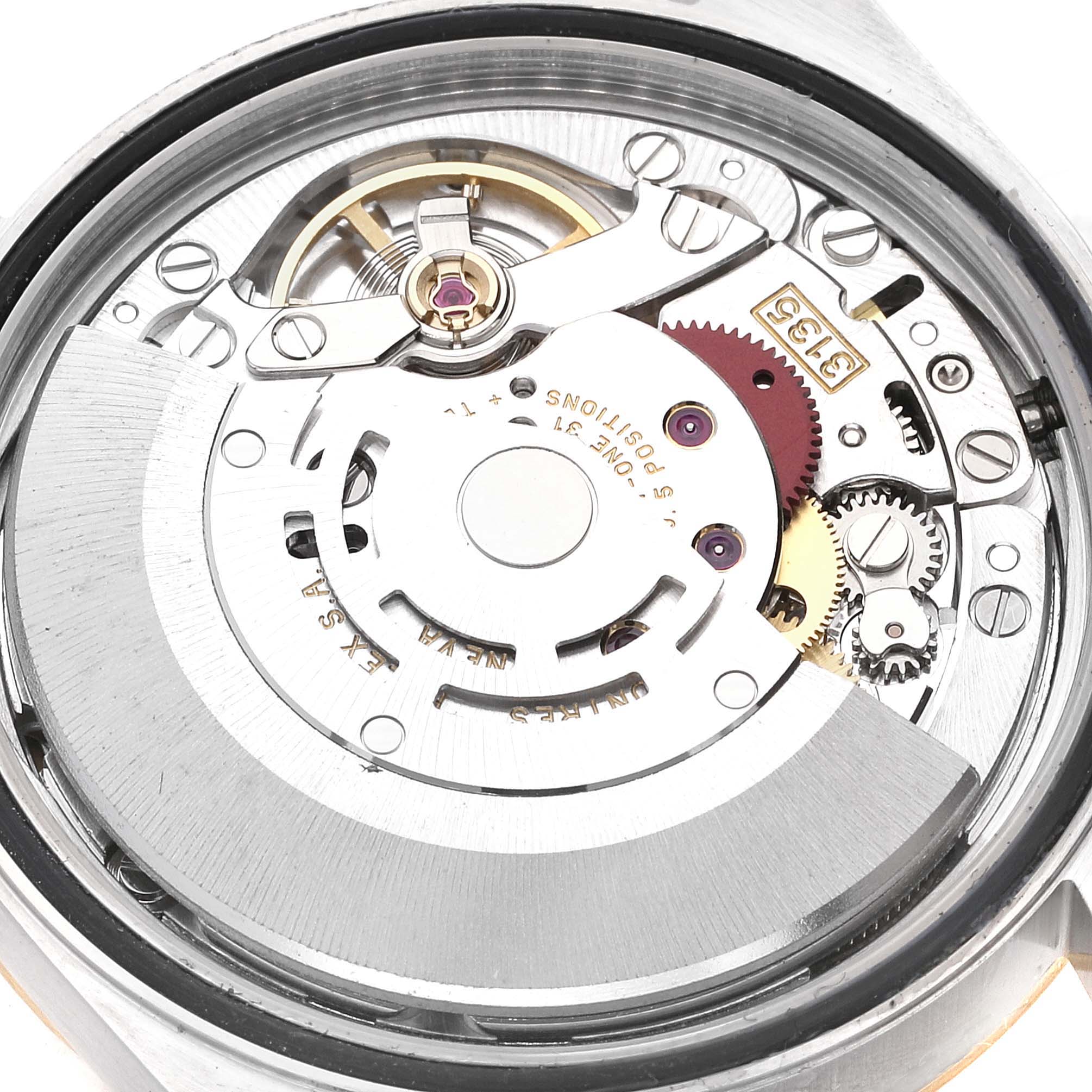 This is an internal view showing the intricate mechanics of a Rolex Datejust 16233 Men's Steel and Gold (two tone) Champagne Dial 16233 Men's Steel and Gold (two tone) Champagne Dial watch.