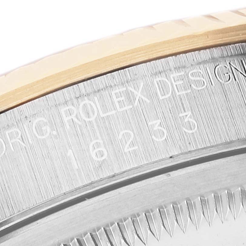 This close-up image shows the engraved model number "16233" on the side of a Rolex Datejust 16233 Men
s Steel and Gold (two tone) Grey Dial 16233 Men
s Steel and Gold (two tone) Grey Dial watch case.