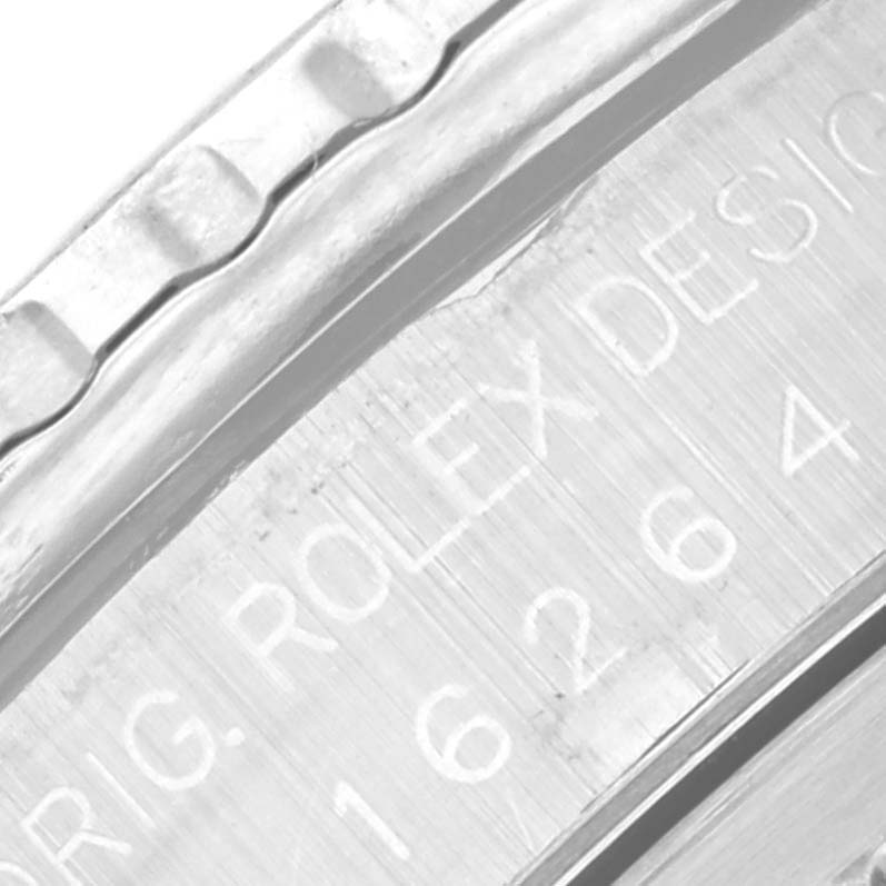 Close-up of the side of the Rolex Turn-o-Graph 16264 Men's Stainless Steel Black Dial 16264 Men's Stainless Steel Black Dial model showing the engraved text and part of the bezel.