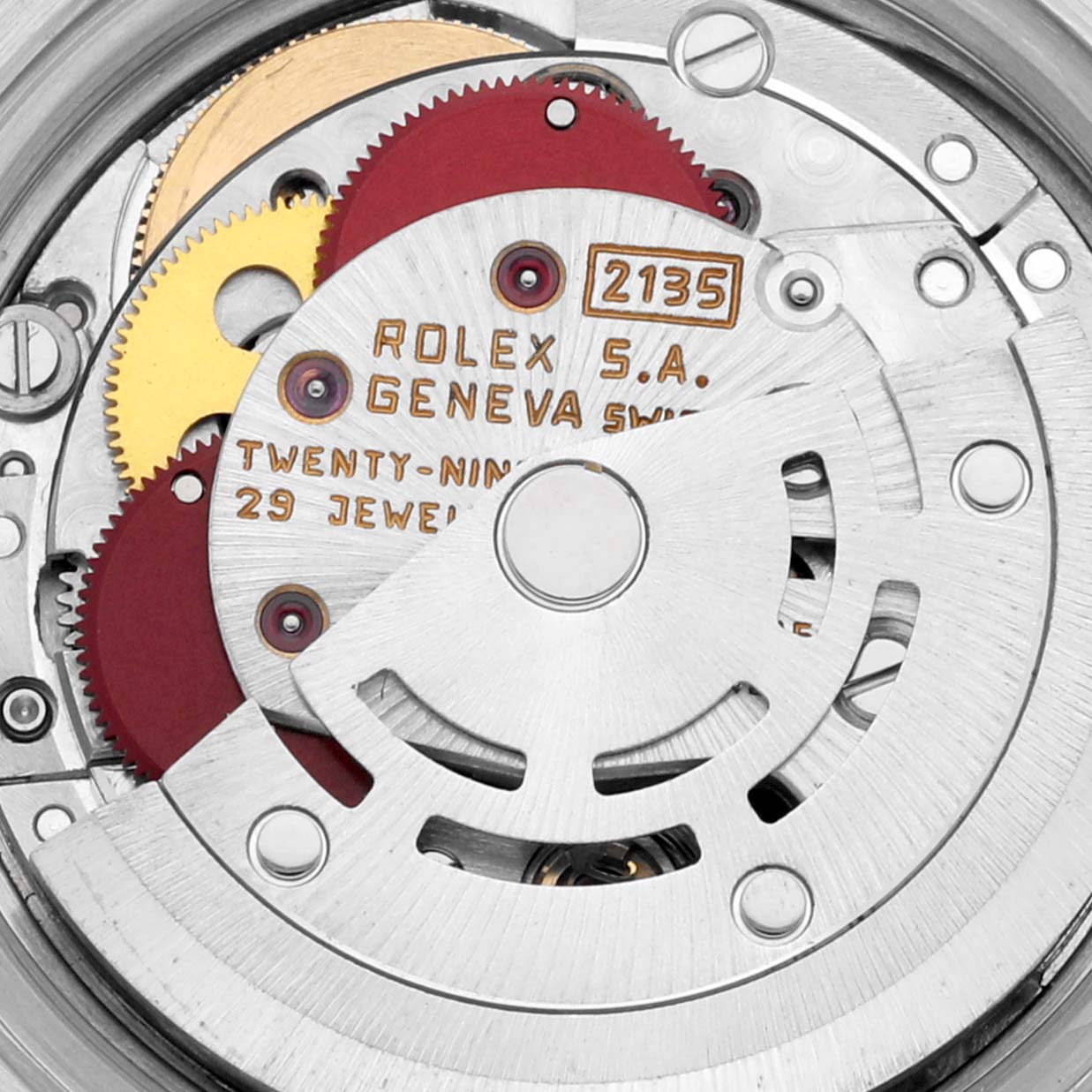 The image shows the internal mechanism of a Rolex Datejust 69173 Women's Steel and Gold (two tone) White Dial 69173 Women's Steel and Gold (two tone) White Dial model watch from a close-up angle, highlighting the gears and inscriptions.