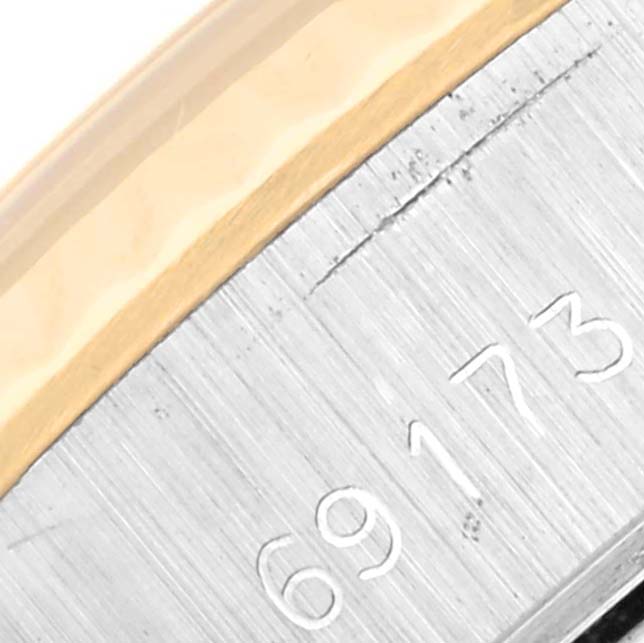 Close-up of the Rolex Datejust 69173 Women's Steel and Gold (two tone) White Dial 69173 Women's Steel and Gold (two tone) White Dial model showing the engraved reference number on the case.