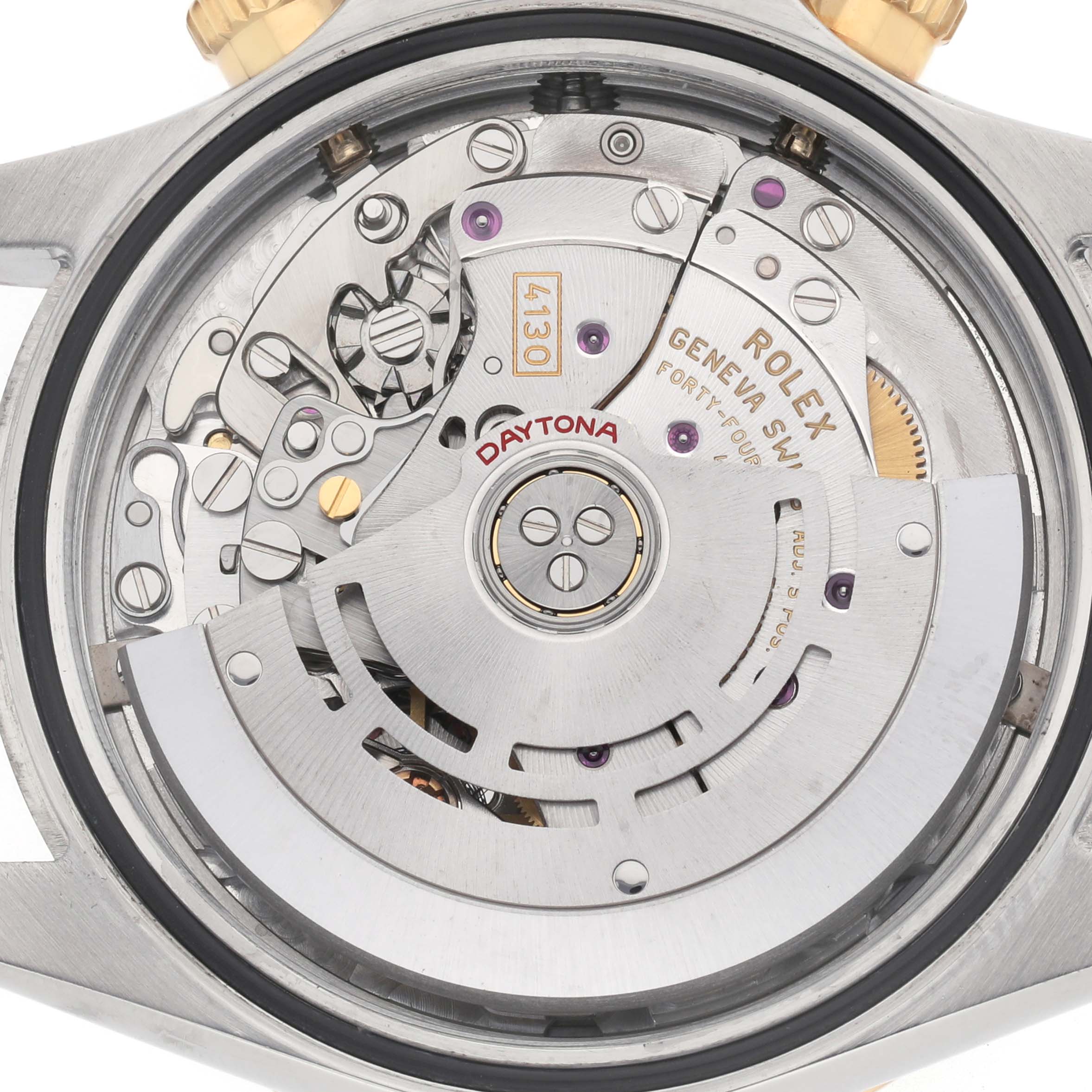 The image shows the back view of a Rolex Daytona 116523 Men's Steel and Gold (two tone) Blue Dial, highlighting its intricate movement and mechanical parts.