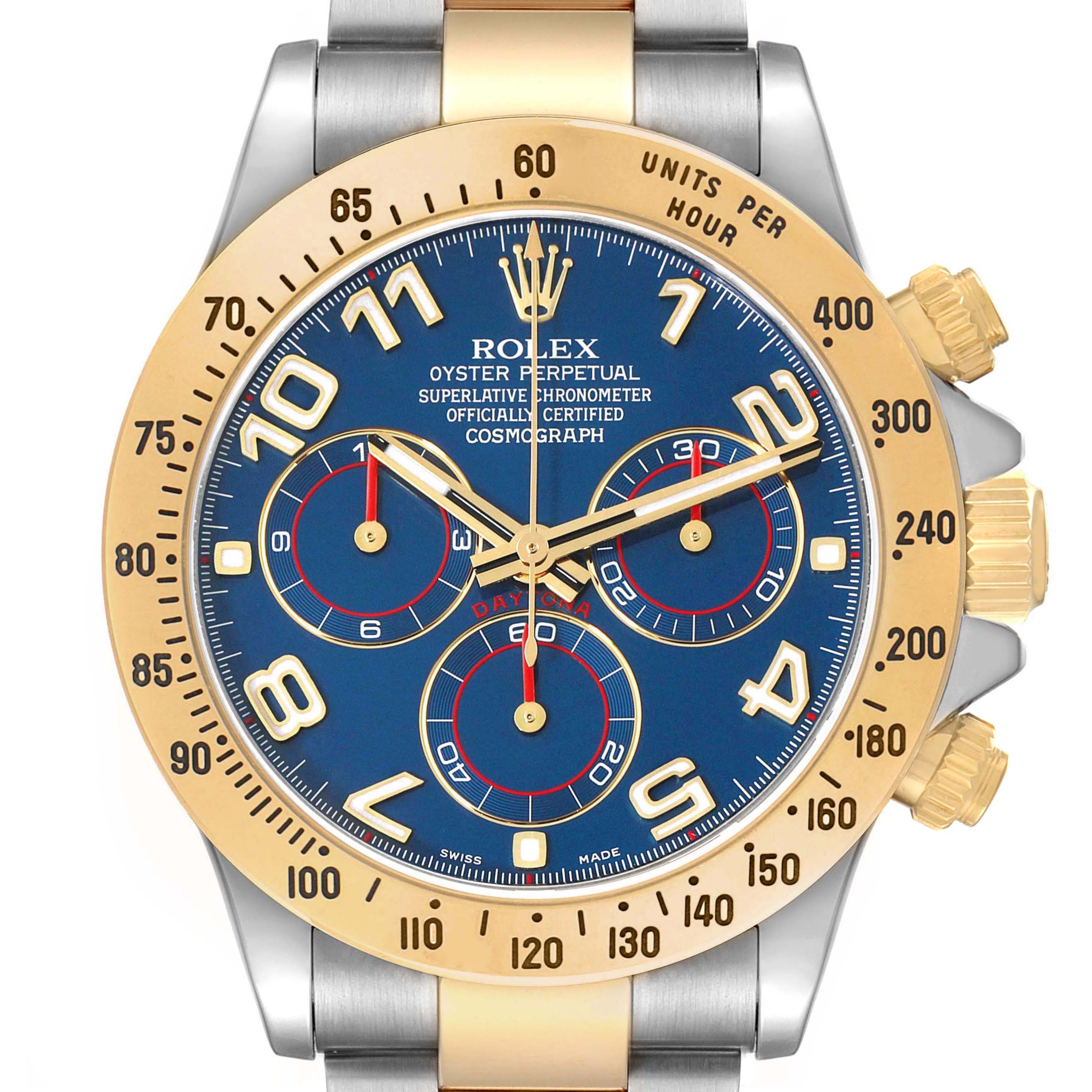 The Rolex Daytona 116523 Men's Steel and Gold (two tone) Blue Dial watch is shown from the front, highlighting its blue dial, gold bezel, and chronograph sub-dials.