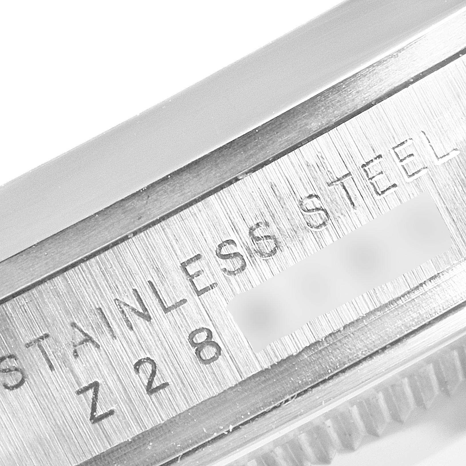 This close-up image shows the side casing details and serial number of the Rolex Explorer 114270 Men
s Stainless Steel Black Dial 114270 Men
s Stainless Steel Black Dial model watch in stainless steel.