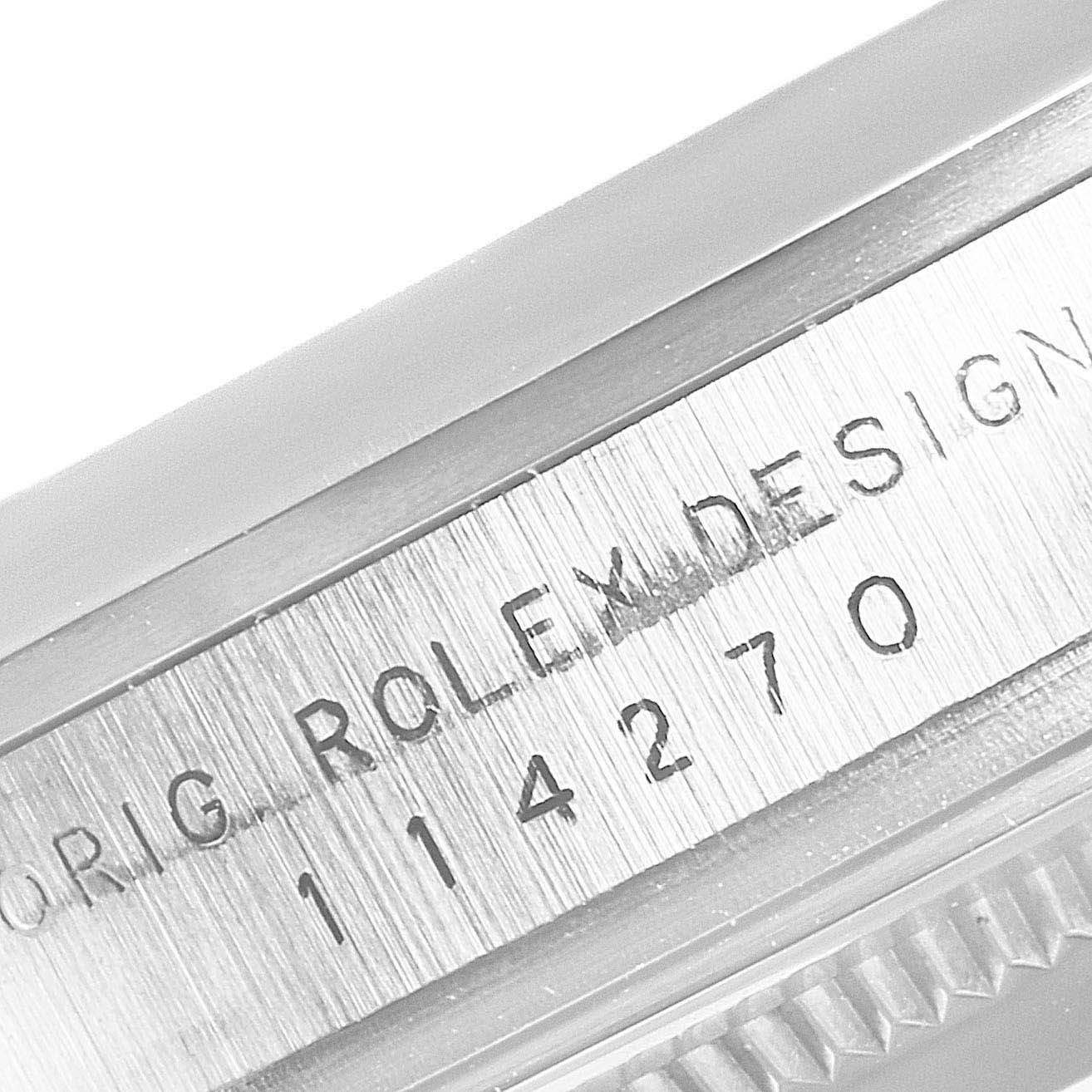 The image shows a close-up of the engraved inner bezel and serial number of the Rolex Explorer 114270 Men
s Stainless Steel Black Dial 114270 Men
s Stainless Steel Black Dial watch.