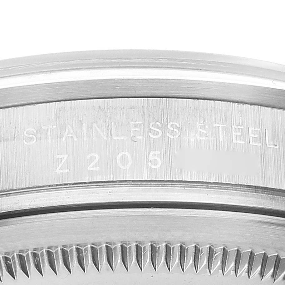 This image shows a close-up of the side engraving on the bezel of a Rolex Explorer 114270 Men's Stainless Steel Black Dial 114270 Men's Stainless Steel Black Dial watch.