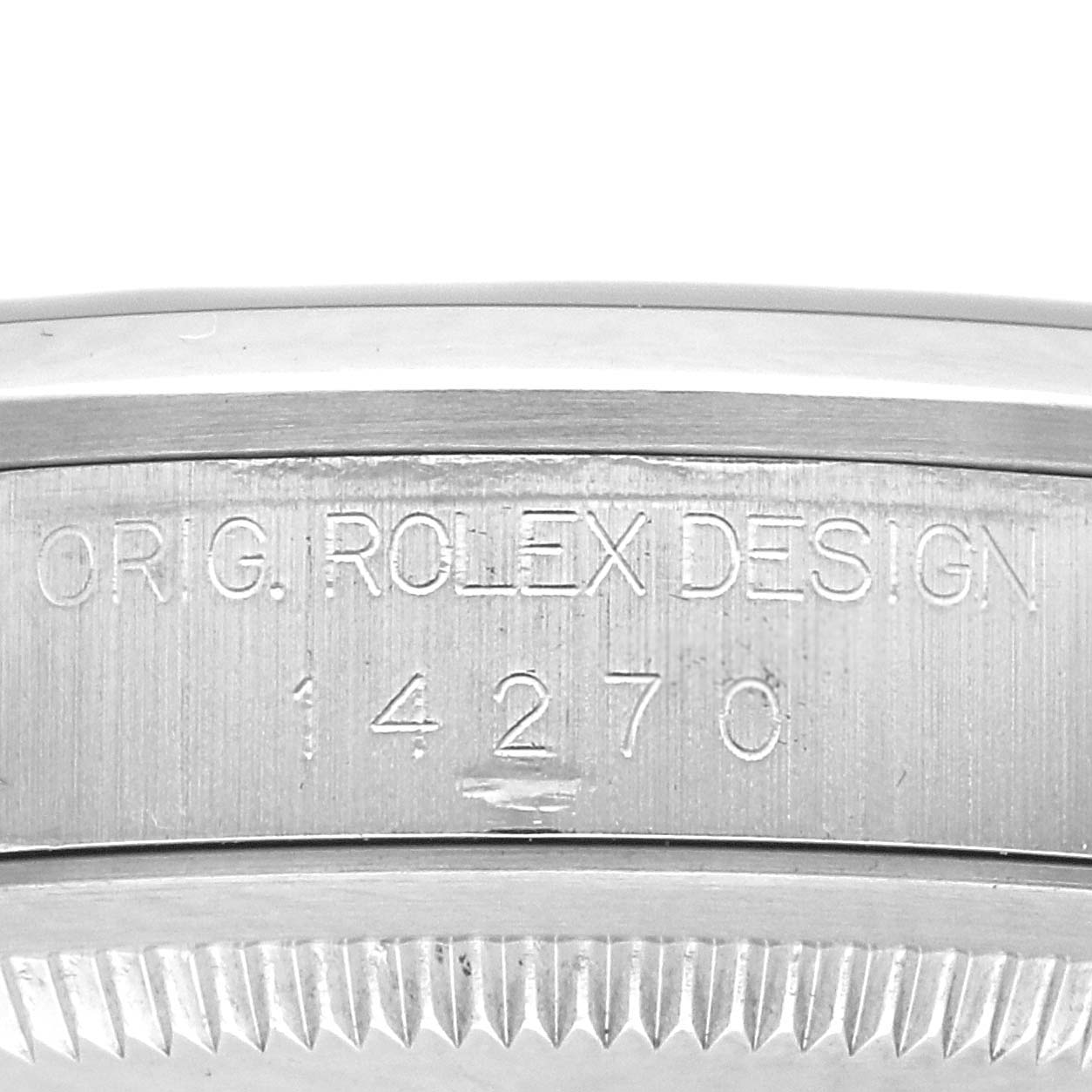 The image shows the side of the Rolex Explorer 14270 Men
s Stainless Steel Black Dial watch case with "ORIG. ROLEX DESIGN" and model number 14270 engraved.