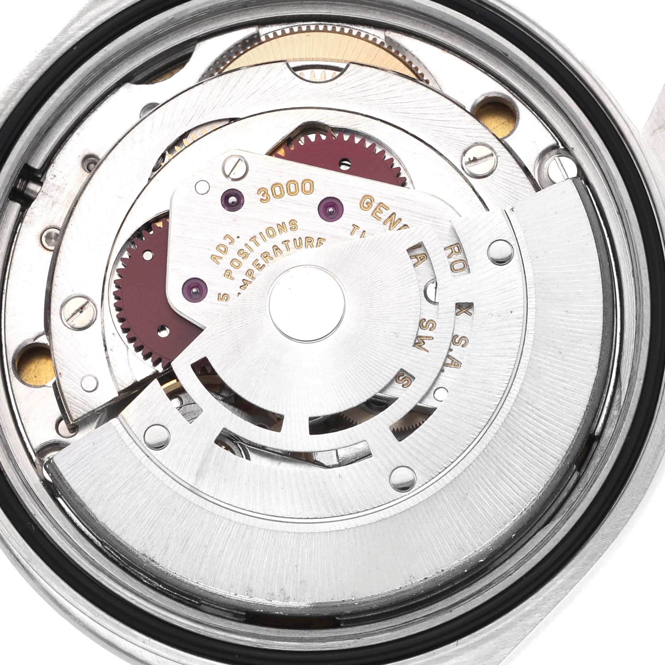 The image shows a detailed view of the Rolex Explorer 14270 Men
s Stainless Steel Black Dial model
s movement parts from the back.