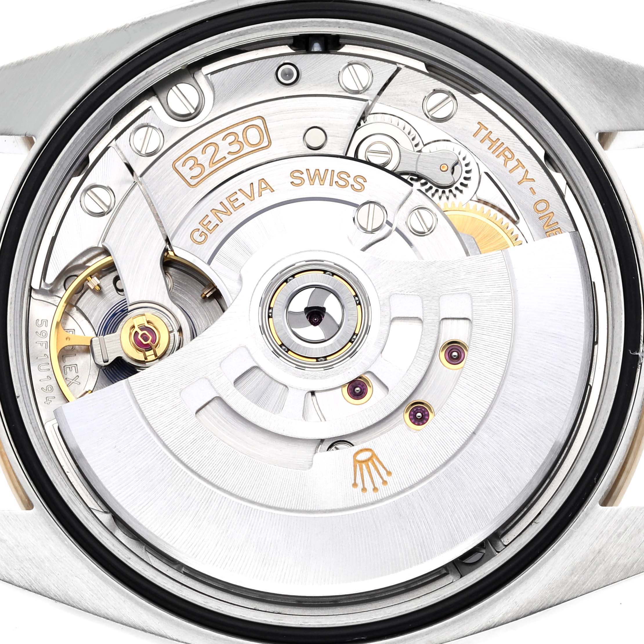 This is the back view of a Rolex Explorer 124273 Men
s Steel and Gold (two tone) Black Dial 124273 Men
s Steel and Gold (two tone) Black Dial watch, showcasing its intricate movement and internal mechanisms.