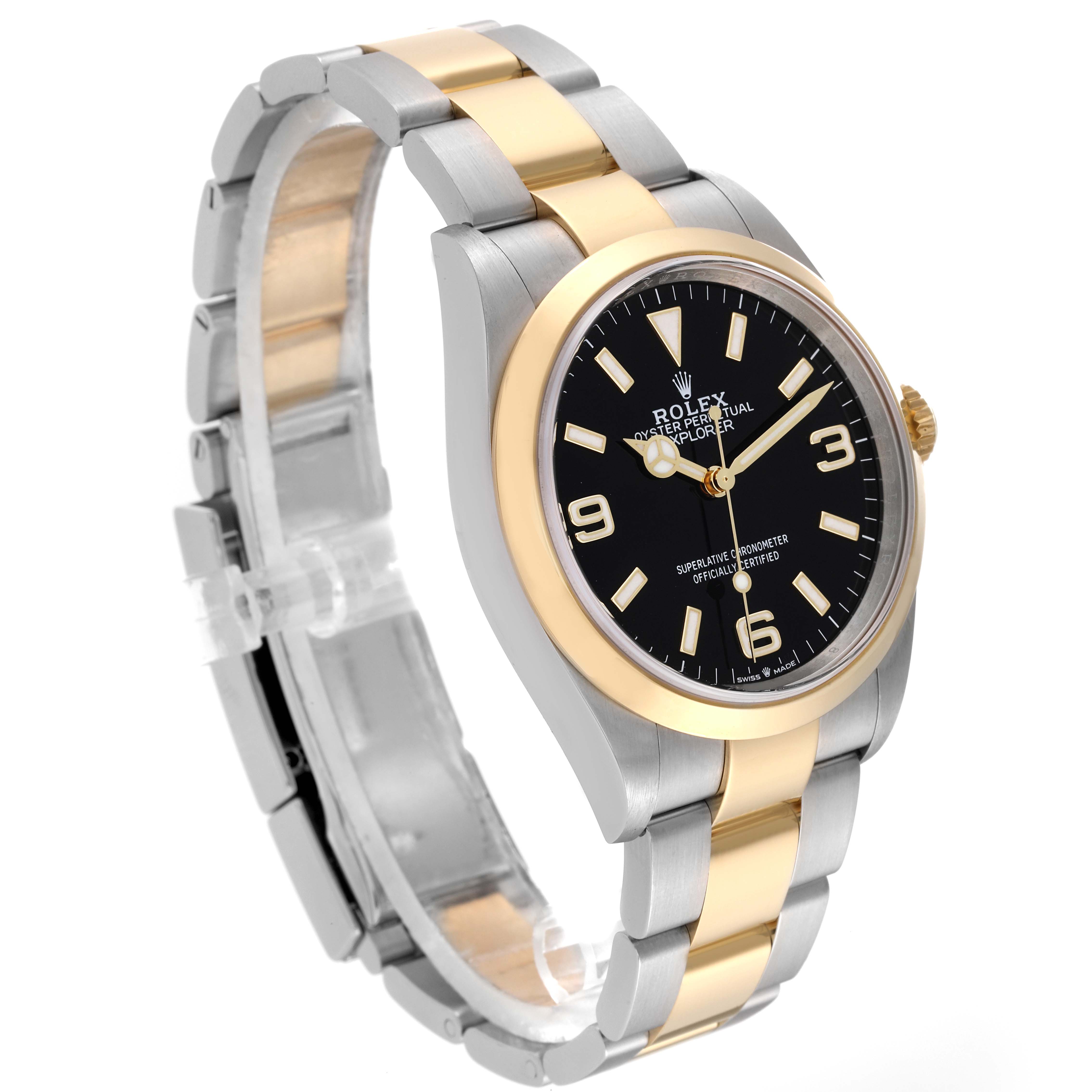 The image shows a side angle of a Rolex Explorer 124273 Men
s Steel and Gold (two tone) Black Dial 124273 Men
s Steel and Gold (two tone) Black Dial watch, highlighting its stainless steel and gold bracelet, black dial, and gold bezel.