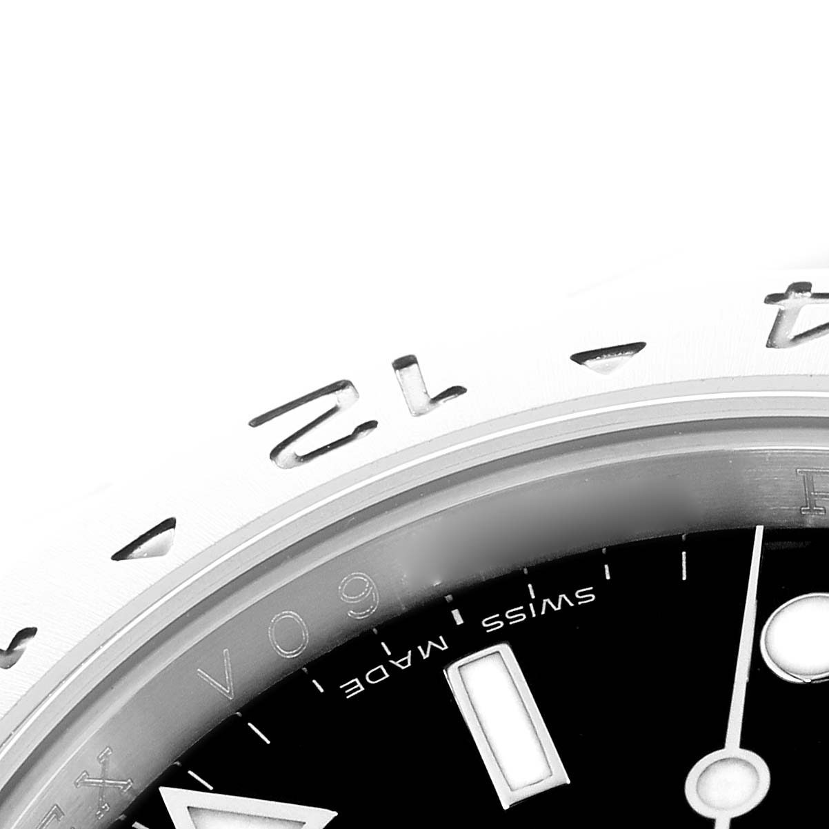 The image shows a close-up of the bezel and part of the dial of a Rolex Explorer 16570 Men
s Stainless Steel Black Dial watch, highlighting the numbers and Swiss Made text.