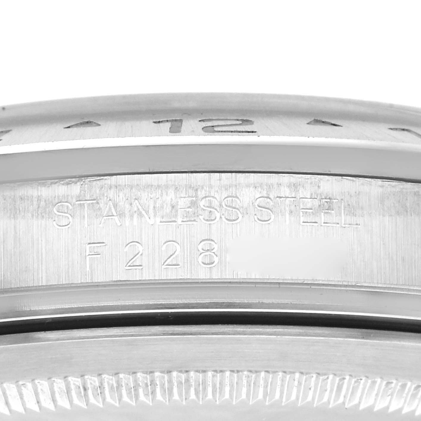 This image shows a close-up of the back casing and the engraving of a Rolex Explorer 16570 Men's Stainless Steel Black Dial 16570 Men's Stainless Steel Black Dial watch, highlighting "Stainless Steel" and a partial serial number.