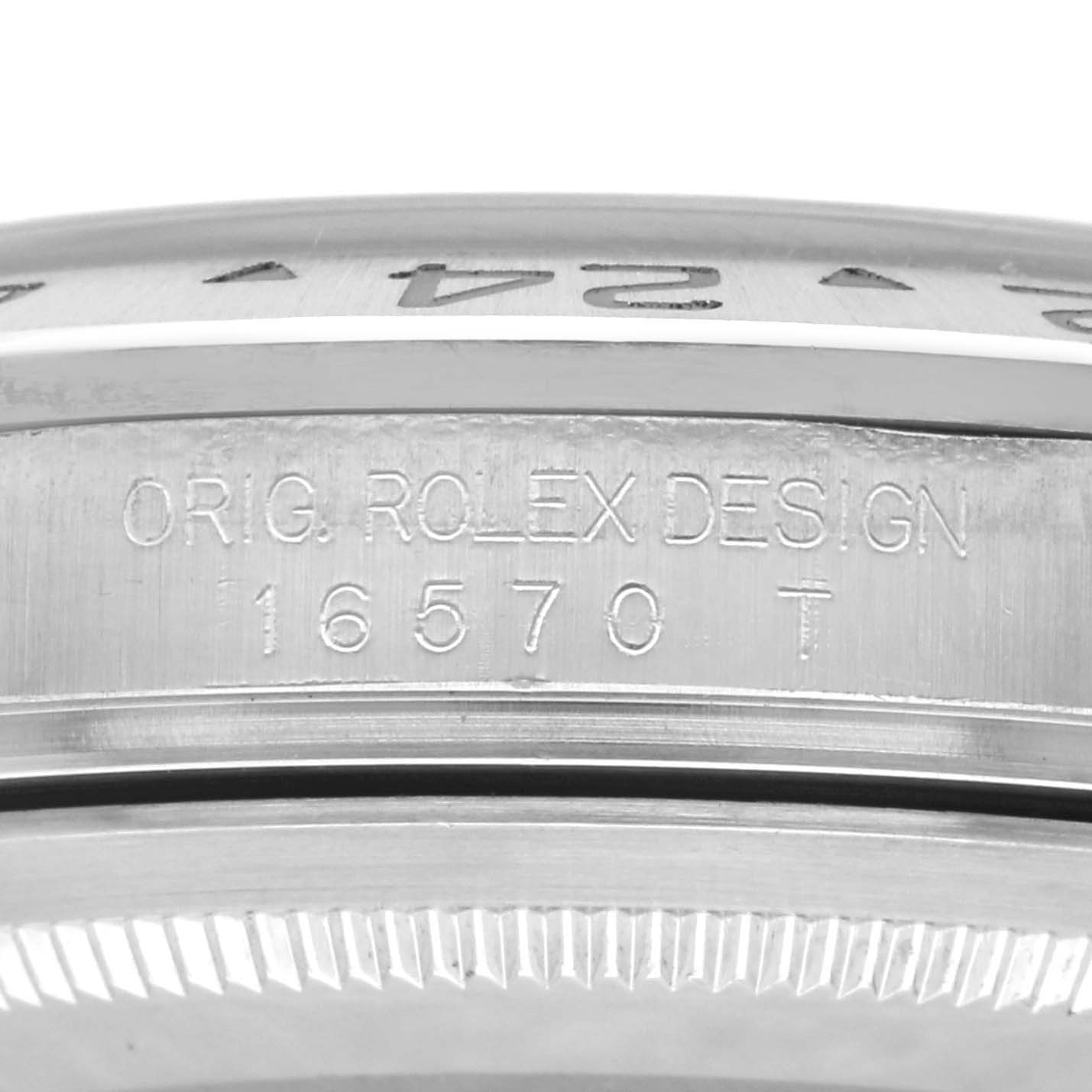 The image shows a close-up of the engraved model number and design inscription on the side of a Rolex Explorer 16570 Men's Stainless Steel Black Dial 16570 Men's Stainless Steel Black Dial watch case.