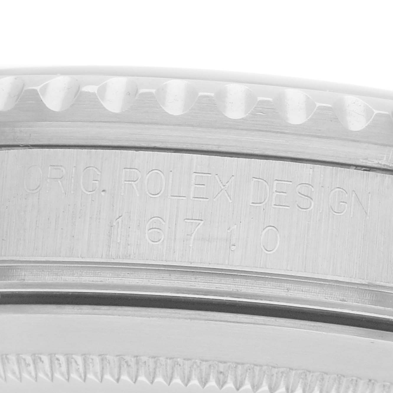 The image shows the side view of a Rolex GMT-Master 16710 Men
s Stainless Steel Black Dial model, highlighting the engraved serial number and design details.