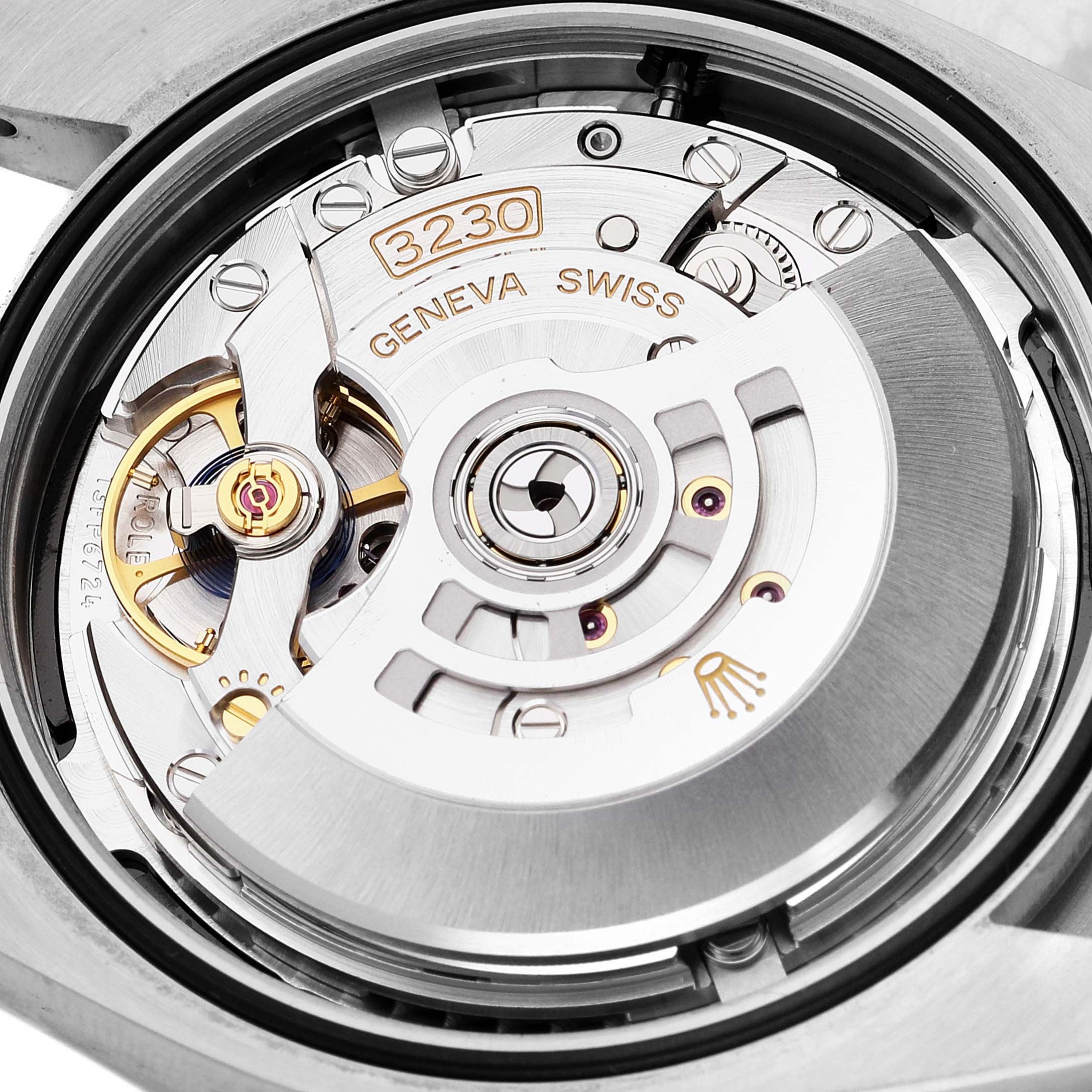 The image shows the intricate inner mechanics of the Rolex Oyster Perpetual 124300 Men's Stainless Steel Black Dial 124300 Men's Stainless Steel Black Dial's movement from a close-up angle.