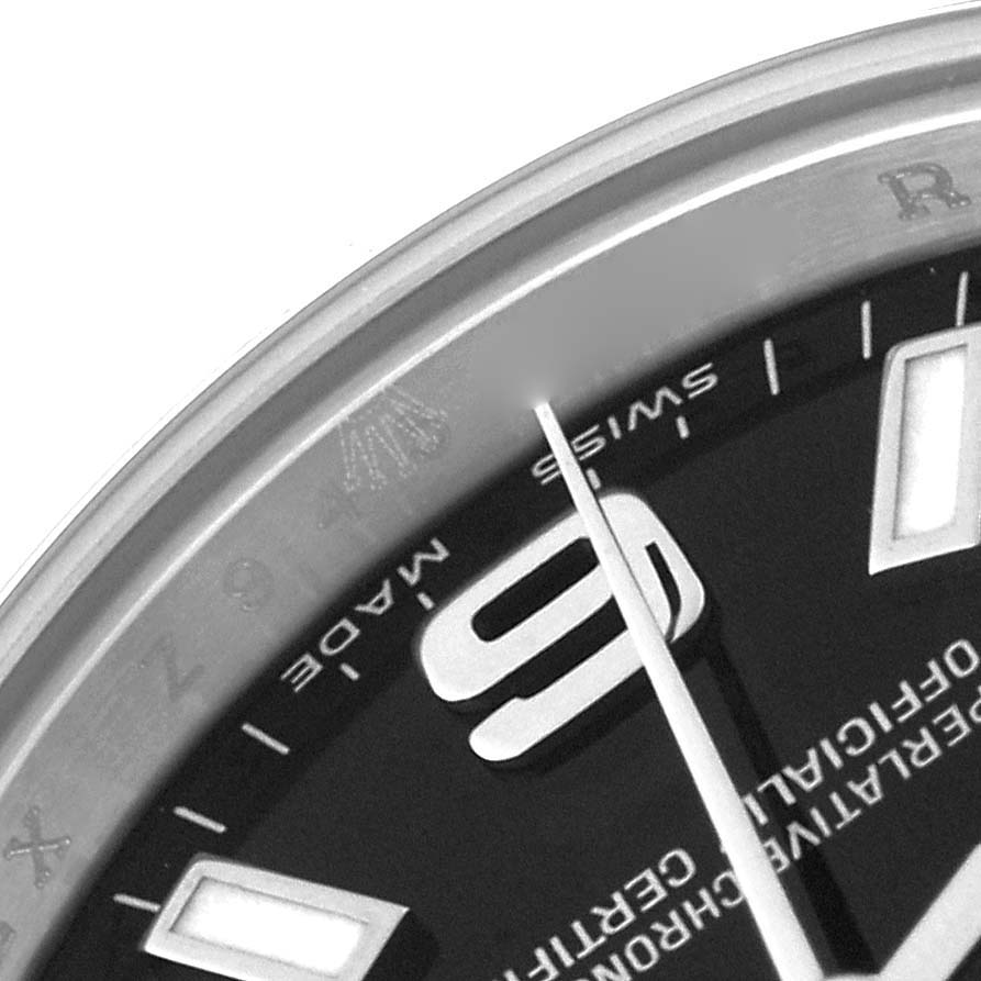 The image shows a close-up of the dial and part of the bezel of a Rolex Oyster Perpetual 176200 Women's Stainless Steel Black Dial 176200 Women's Stainless Steel Black Dial watch, displaying the number 9 and Rolex branding.