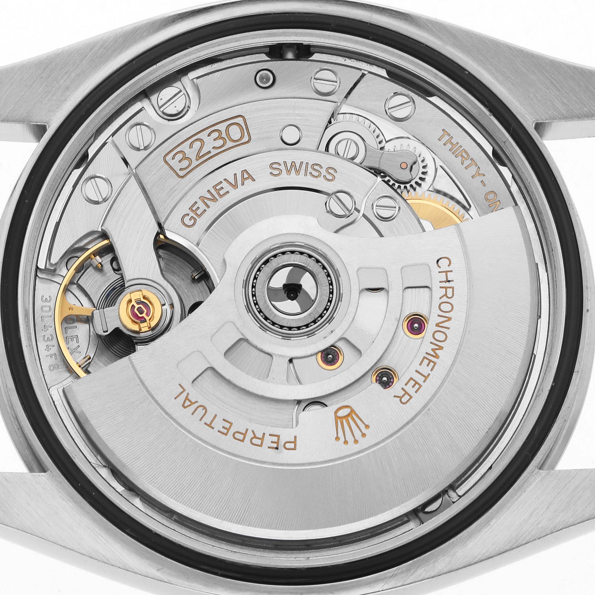 The image shows the back view of a Rolex Oyster Perpetual 126000 Men
s Stainless Steel Blue Dial, displaying its movement mechanism and rotor.