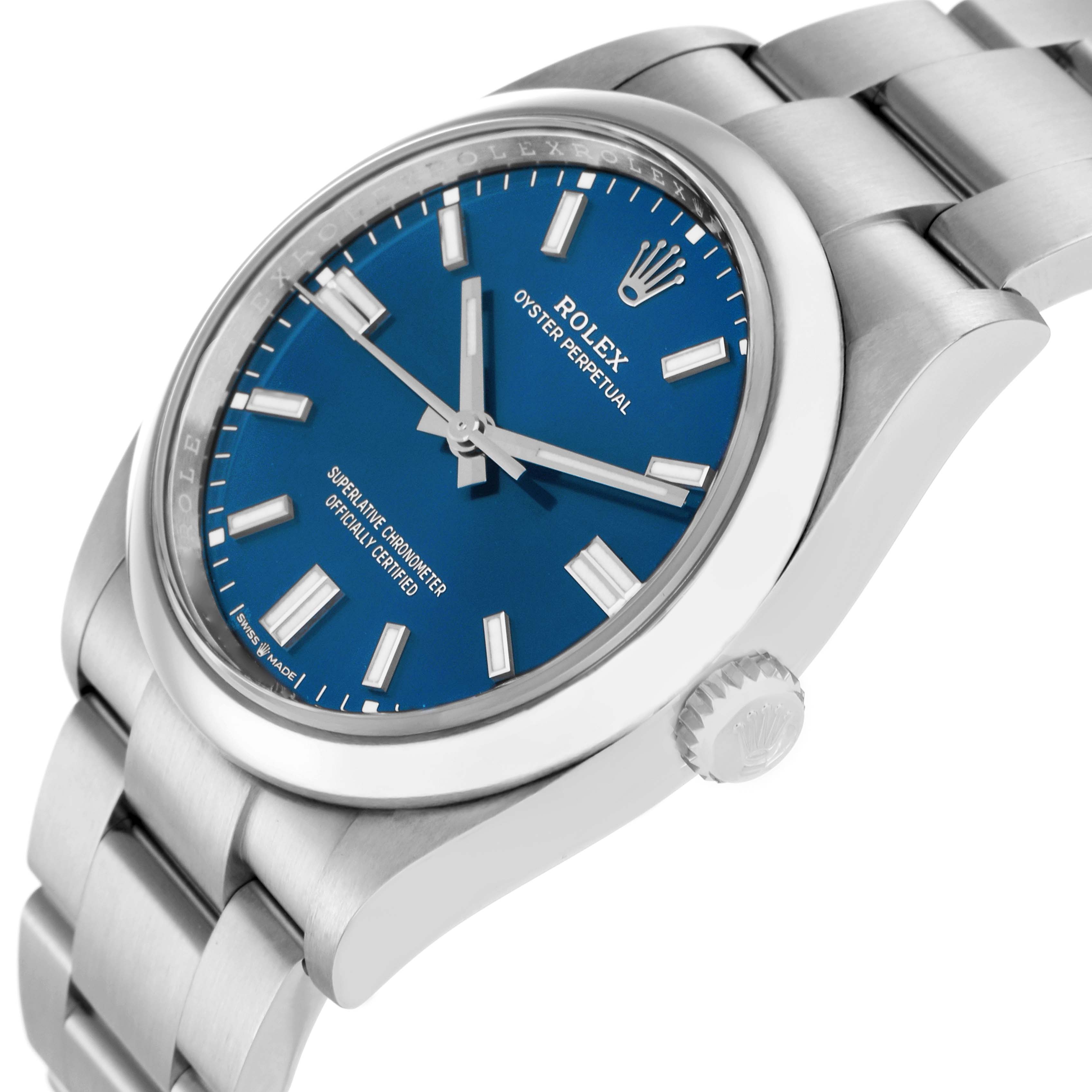 The Rolex Oyster Perpetual 126000 Men
s Stainless Steel Blue Dial is shown at a slight angle, highlighting the blue dial, crown, and part of the bracelet.
